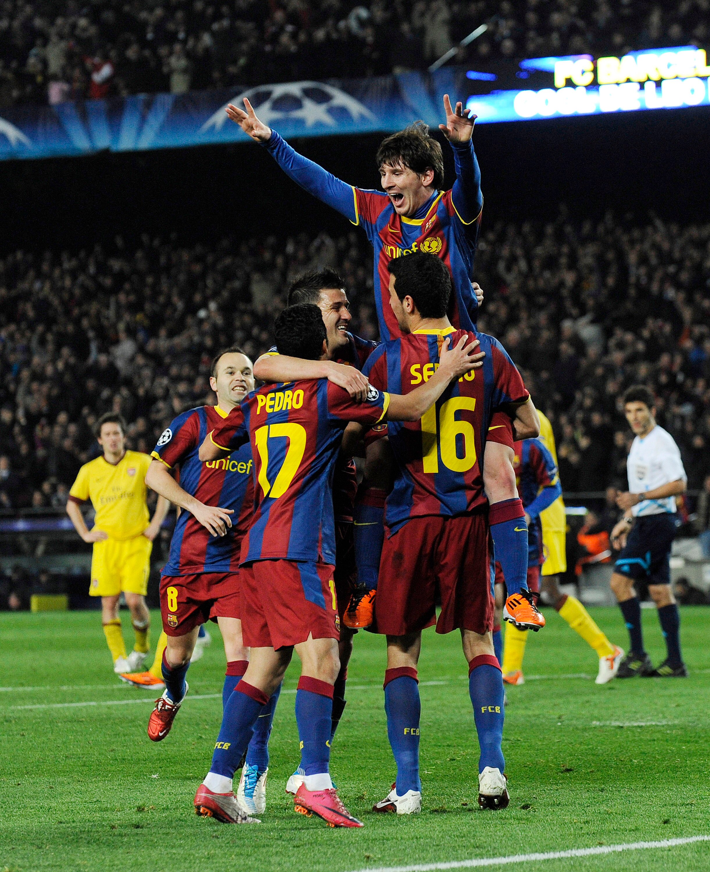 BARCELONA, SPAIN - MARCH 08:  Lionel Messi of FC Barcelona (C) celebrates with his teammates after scoring his second goal during the UEFA Champions League round of 16 second leg match between Barcelona and Arsenal at the Camp Nou stadium on March 8, 2011