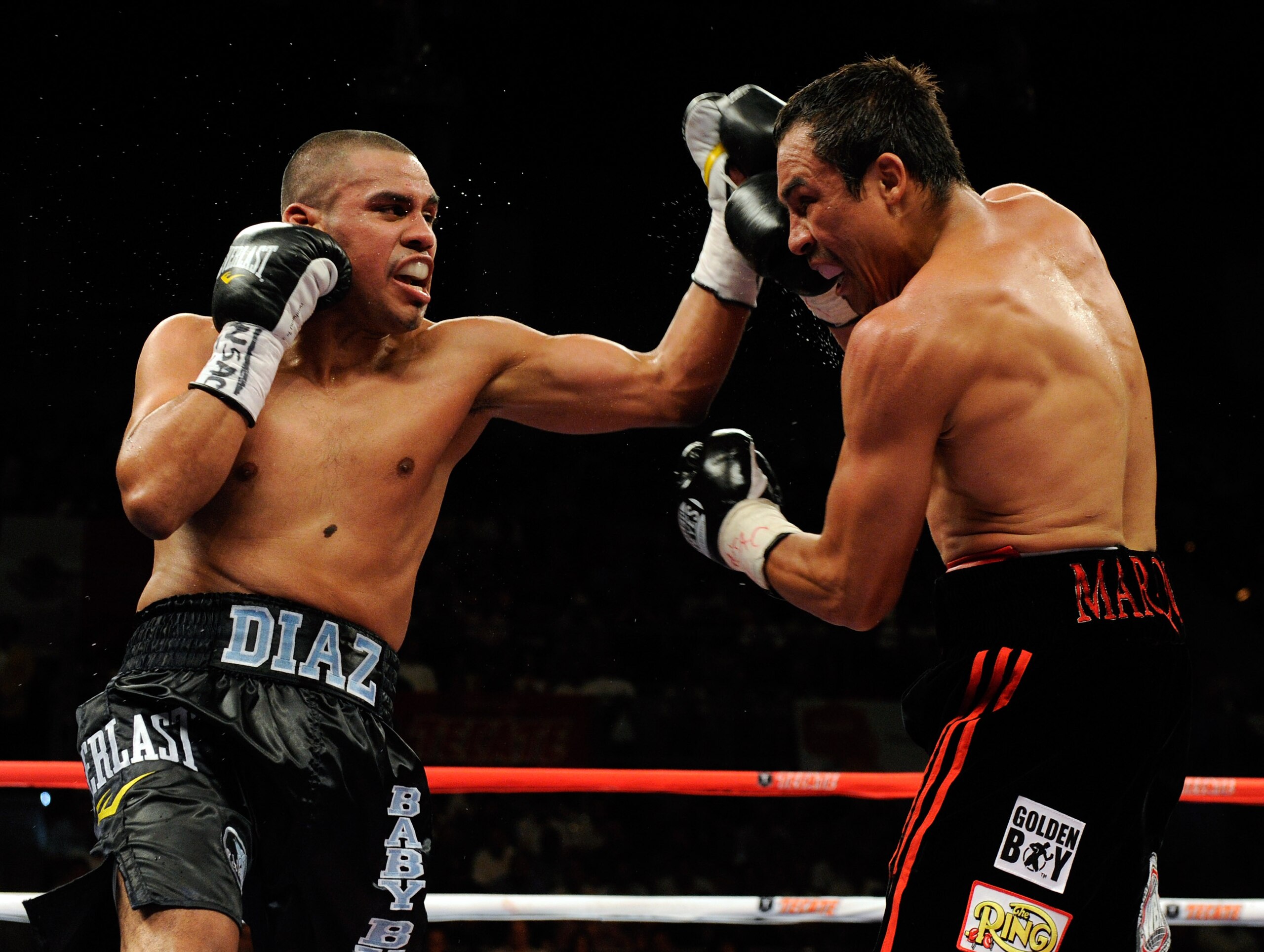 LAS VEGAS - JULY 31:  Juan Diaz (L) and WBA/WBO lightweight champion Juan Manuel Marquez battle in the third round of their bout at the Mandalay Bay Events Center July 31, 2010 in Las Vegas, Nevada. Marquez retained his WBA and WBO lightweight championshi