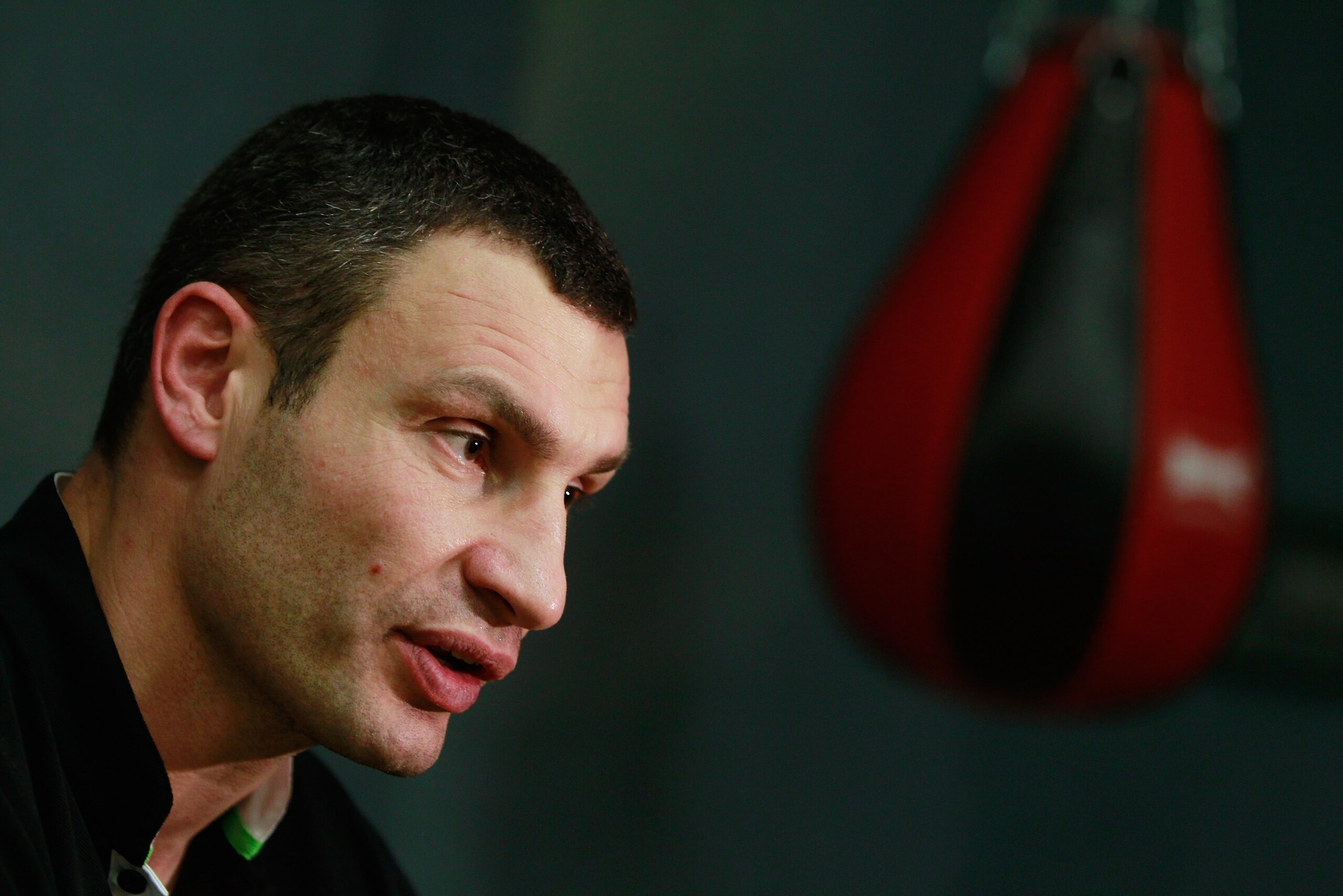 BERLIN - NOVEMBER 16:  Pro boxer Vitali Klitschko gives a televison interview after coaching young boxers at the 'Kick im Boxring' at the TC Gruen Weiss boxing hall in Treptow district on November 16, 2010 in Berlin, Germany. The 'Kick im Boxring' project