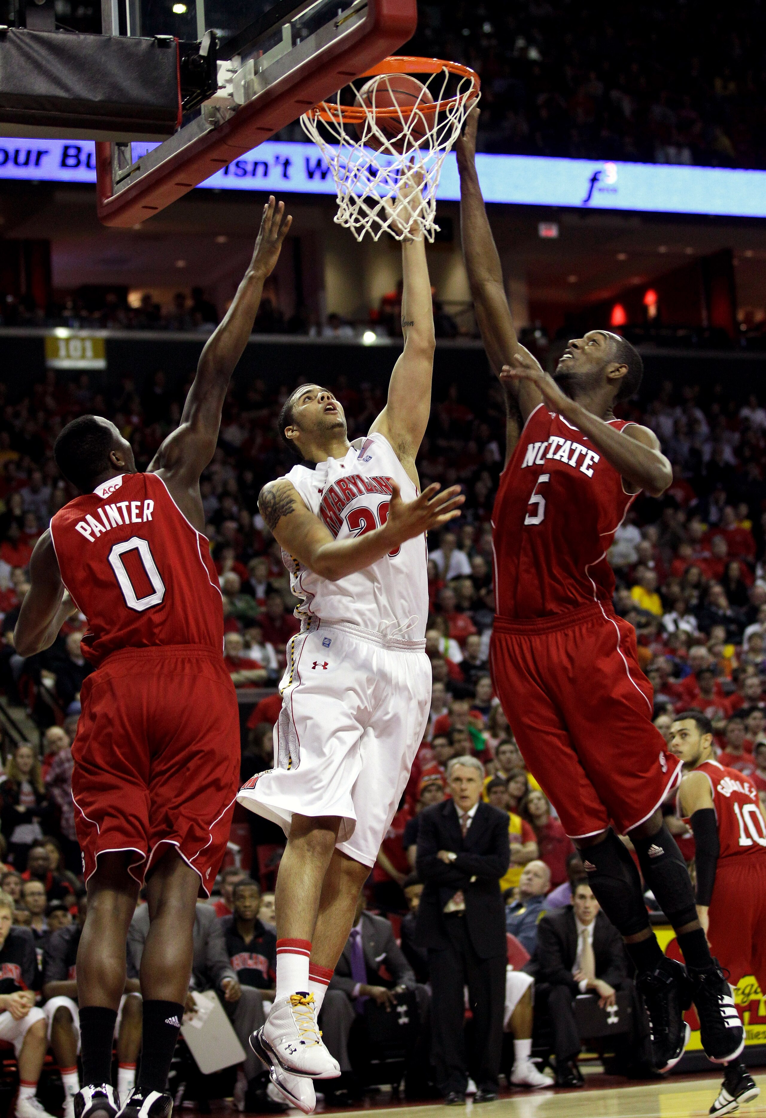 COLLEGE PARK, MD - FEBRUARY 20: Jordan Williams #20 of the Maryland Terrapins #20 puts up a shot over the defense of DeShawn Painter #0 and C.J. Leslie #5 of the North Carolina State Wolfpack at the Comcast Center on February 20, 2011 in College Park, Mar COLLEGE PARK, MD - FEBRUARY 20: Jordan Williams #20 of the Maryland Terrapins #20 puts up a shot over the defense of DeShawn Painter #0 and C.J. Leslie #5 of the North Carolina State Wolfpack at the Comcast Center on February 20, 2011 in College Park, Mar