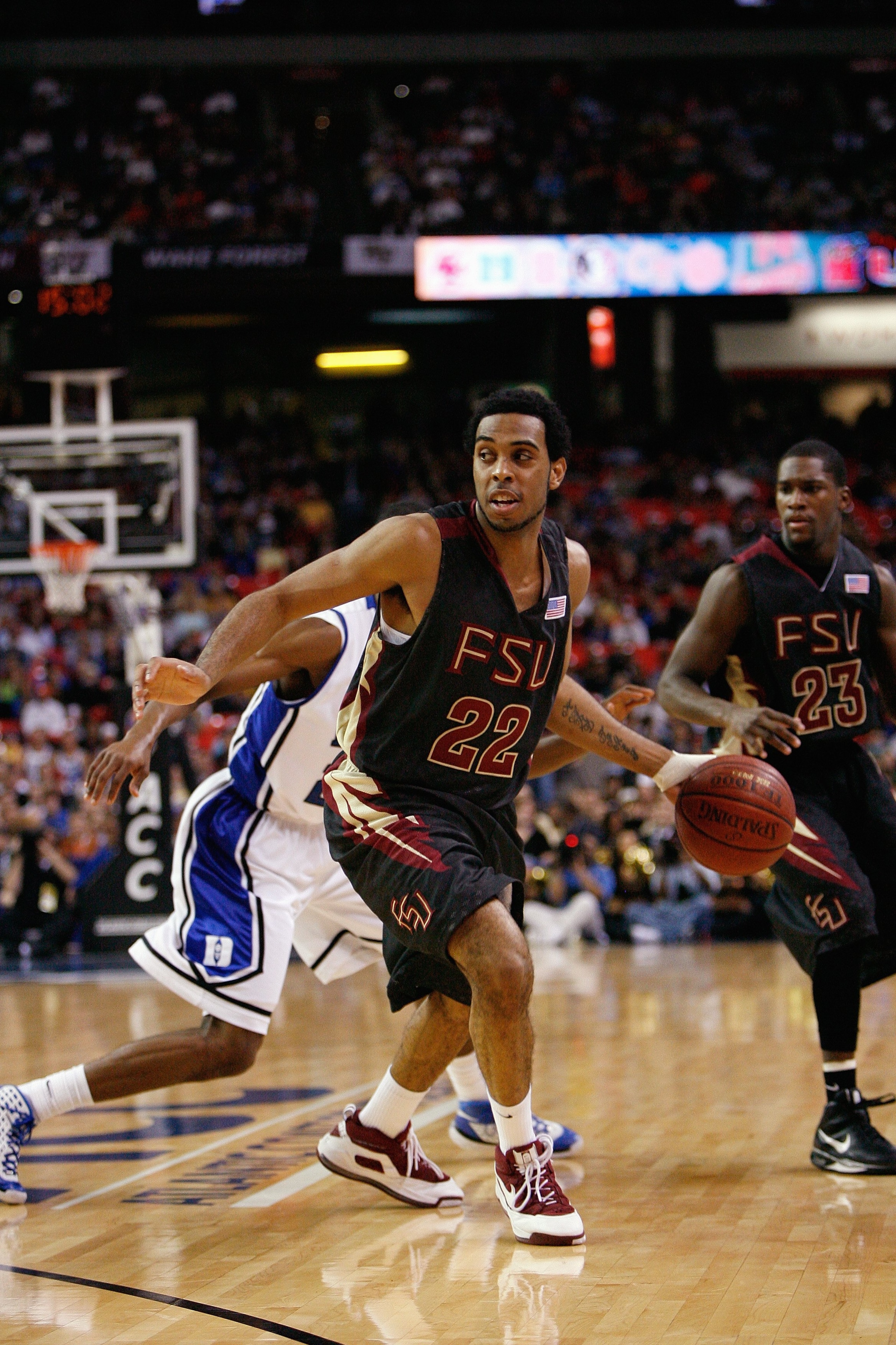 ATLANTA - MARCH 15: Derwin Kitchen #22 of the Florida State Seminoles dribbles against the Duke Blue Devils during the championship game of the 2009 ACC Men's Basketball Tournament on March 15, 2009 at the Georgia Dome in Atlanta, Georgia. (Photo by Kev ATLANTA - MARCH 15: Derwin Kitchen #22 of the Florida State Seminoles dribbles against the Duke Blue Devils during the championship game of the 2009 ACC Men's Basketball Tournament on March 15, 2009 at the Georgia Dome in Atlanta, Georgia. (Photo by Kev