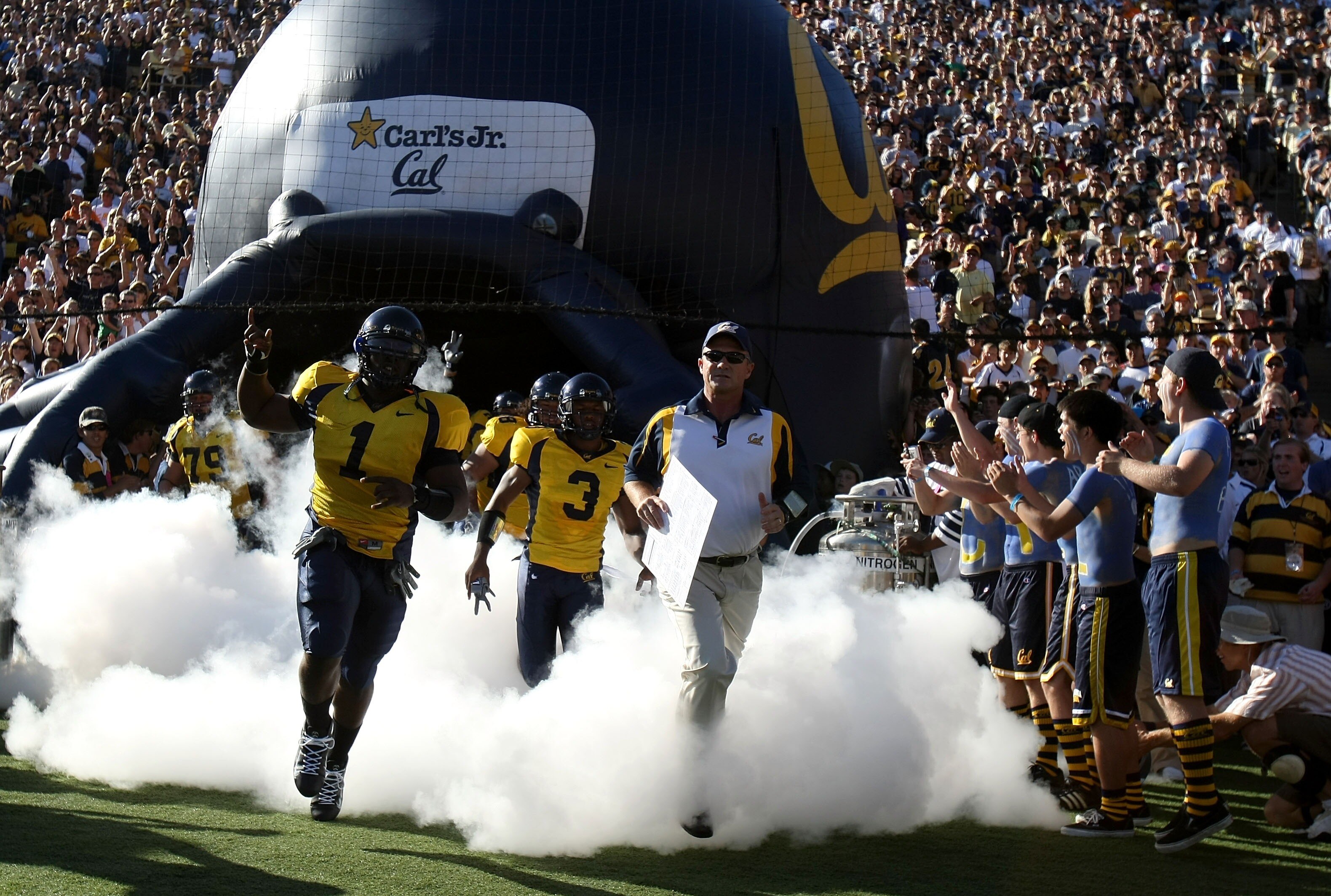 BERKELEY, CA - SEPTEMBER 01:  DeSean Jackson #1 of the California Golden Bears and Head Coach  Jeff Tedford run onto the field before the game against the Tennessee Volunteers at Memorial Stadium on September 1, 2007 in Berkeley, California.  (Photo by Jo