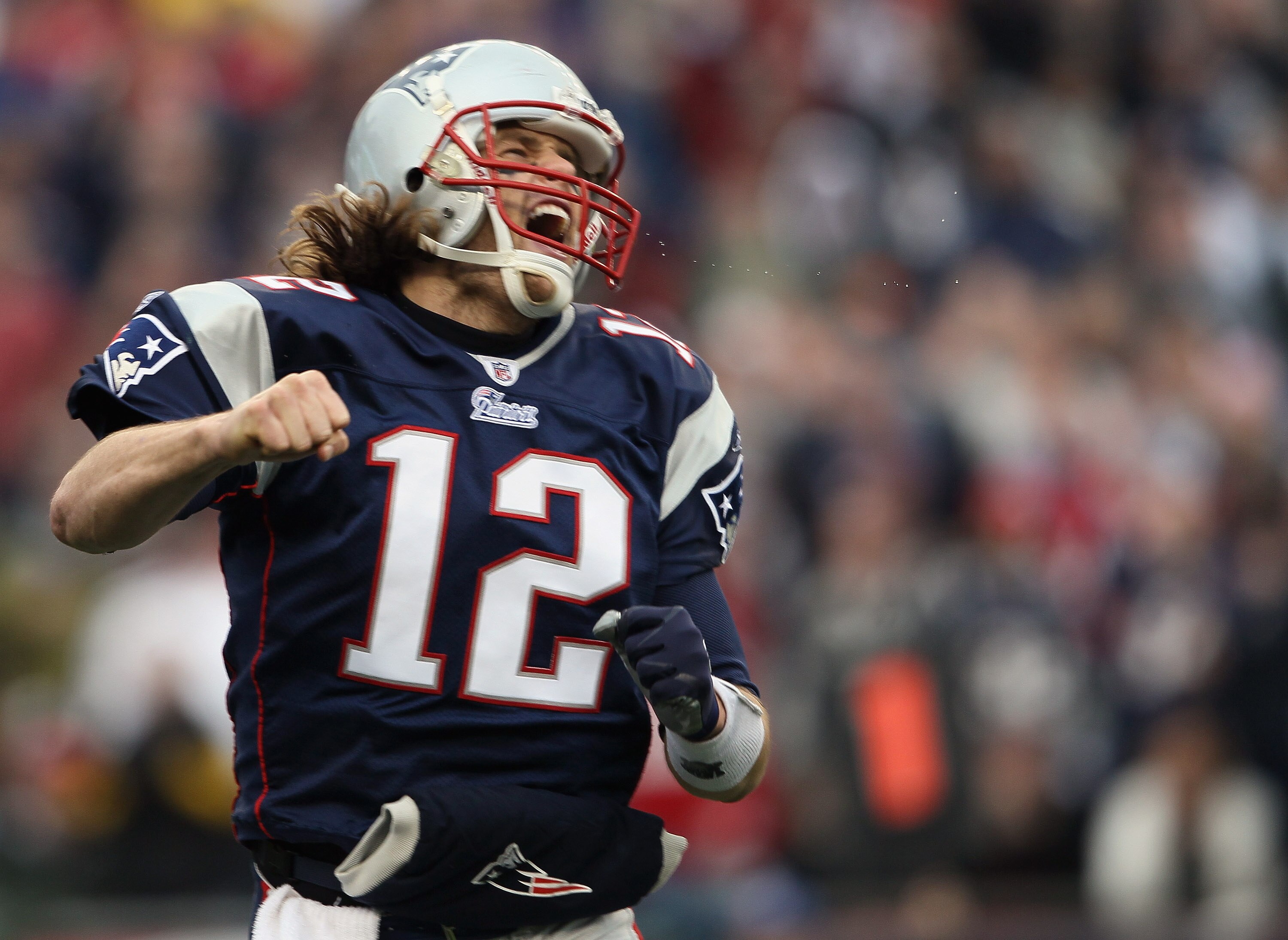 FOXBORO, MA - JANUARY 02:  Tom Brady #12 of the New England Patriots celebrates a touchdown by teammate BenJarvis Green-Ellis in the first quarter against the Miami Dolphins on January 2, 2011 at Gillette Stadium in Foxboro, Massachusetts.  (Photo by Elsa