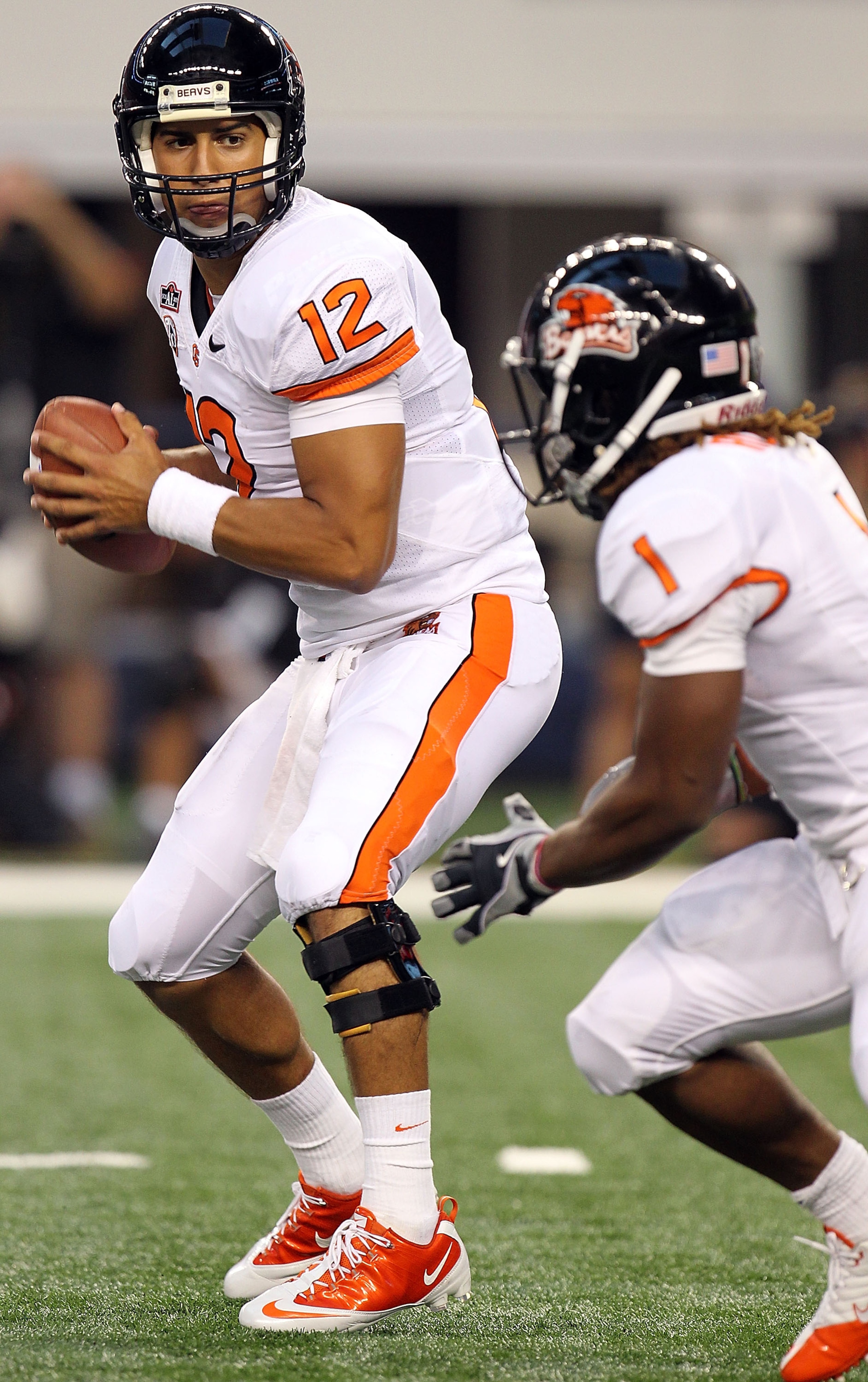 ARLINGTON, TX - SEPTEMBER 04:  Quarterback Ryan Katz #12 of the Oregon State Beavers drops back to pass against the TCU Horned Frogs at Cowboys Stadium on September 4, 2010 in Arlington, Texas.  (Photo by Ronald Martinez/Getty Images)
