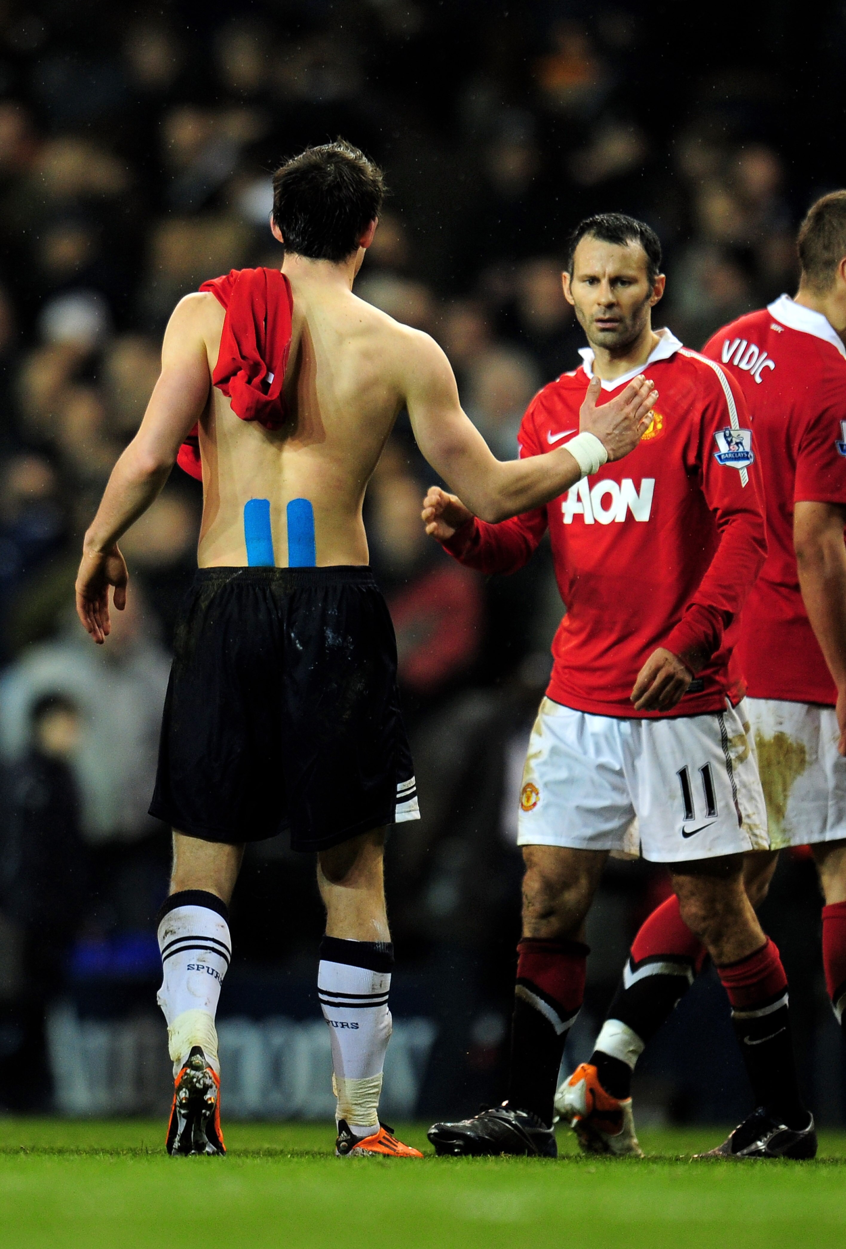 LONDON, ENGLAND - JANUARY 16:  Following the final whistle fellow Welshmen Gareth Bale (L) of Spurs and Ryan Giggs (R) of Manchester United shake hands during the Barclays Premier League match between Tottenham Hotspur and Manchester United at White Hart