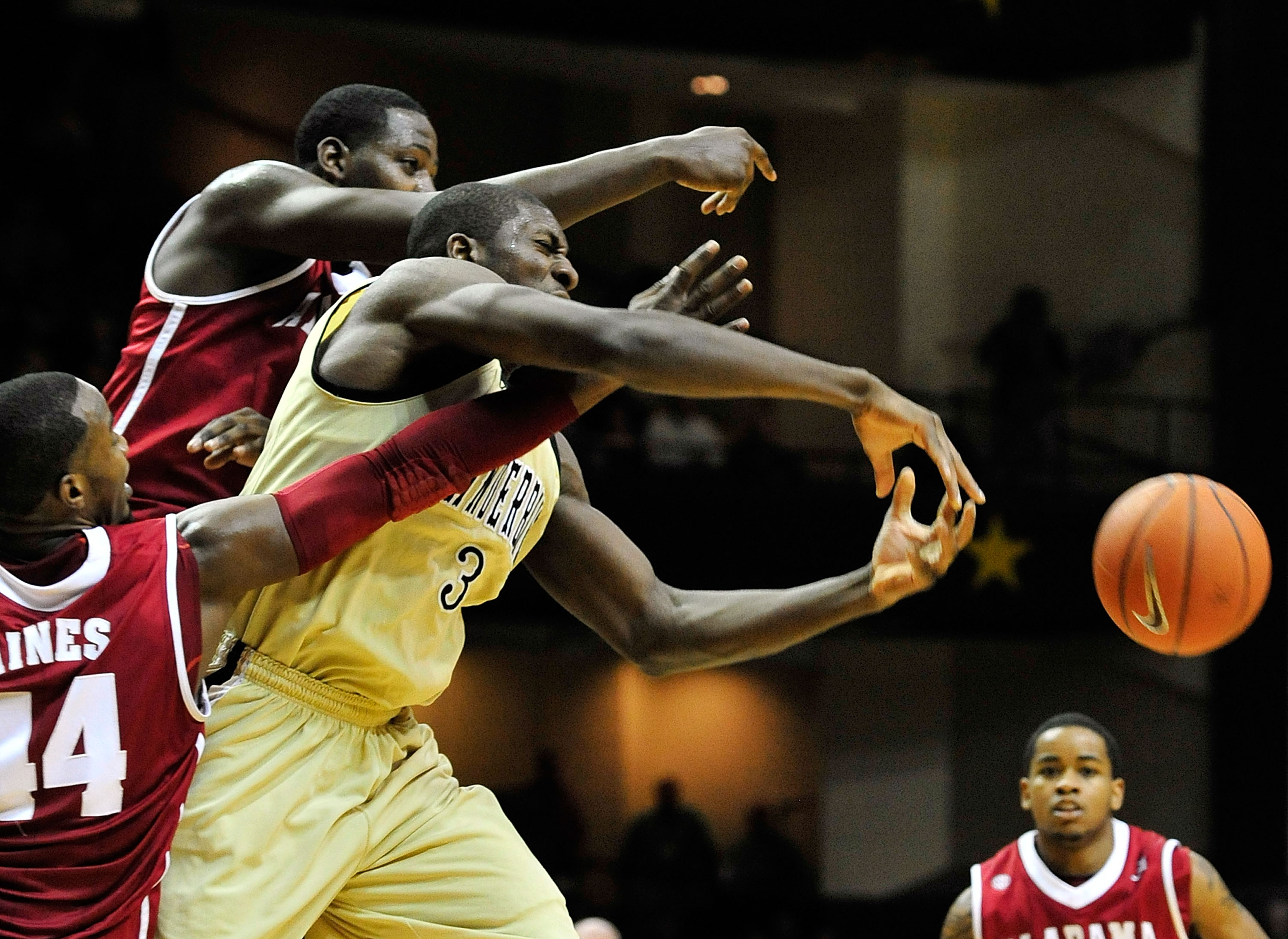 NASHVILLE, TN - FEBRUARY 10:  Festus Ezeli #3 of the Vanderbilt Commodores of battles for the ball with Chris Hines #44 and JaMychal Green #1 the Alabama Crimson Tide at Memorial Gym on February 10, 2011 in Nashville, Tennessee. Vanderbilt won 81-77. (Pho