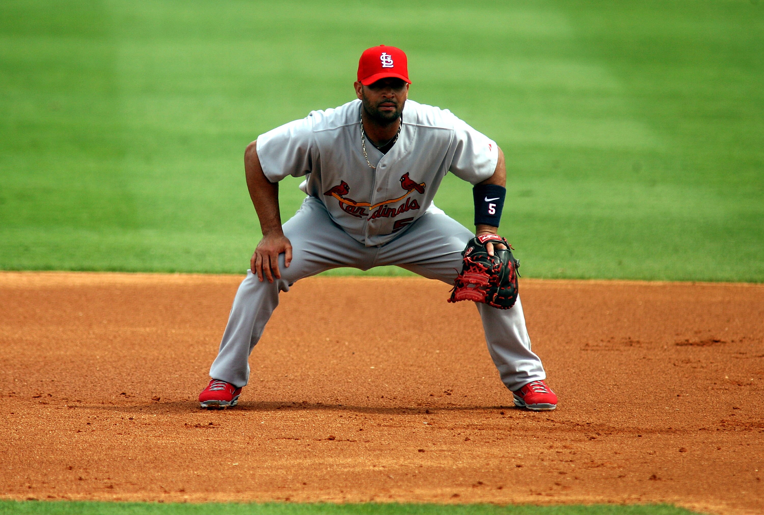 JUPITER, FL - MARCH 06:  First baseman Albert Pujols #5 of the St. Louis Cardinals plays against the Florida Marlins at Roger Dean Stadium on March 6, 2011 in Jupiter, Florida.  (Photo by Marc Serota/Getty Images)