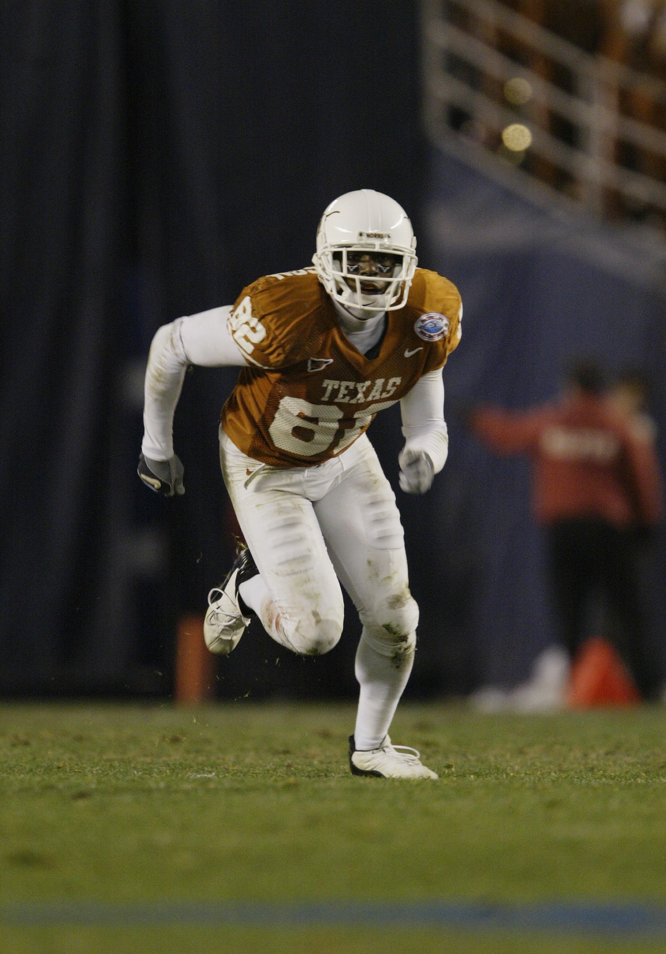 SAN DIEGO - DECEMBER 30:  Wide receiver B.J. Johnson #82 of the University of Texas Longhorns runs downfield during the game against the Washington State Cougars in the Pacific Life Holiday Bowl on December 30, 2003 at Qualcomm Stadium in San Diego, Calif