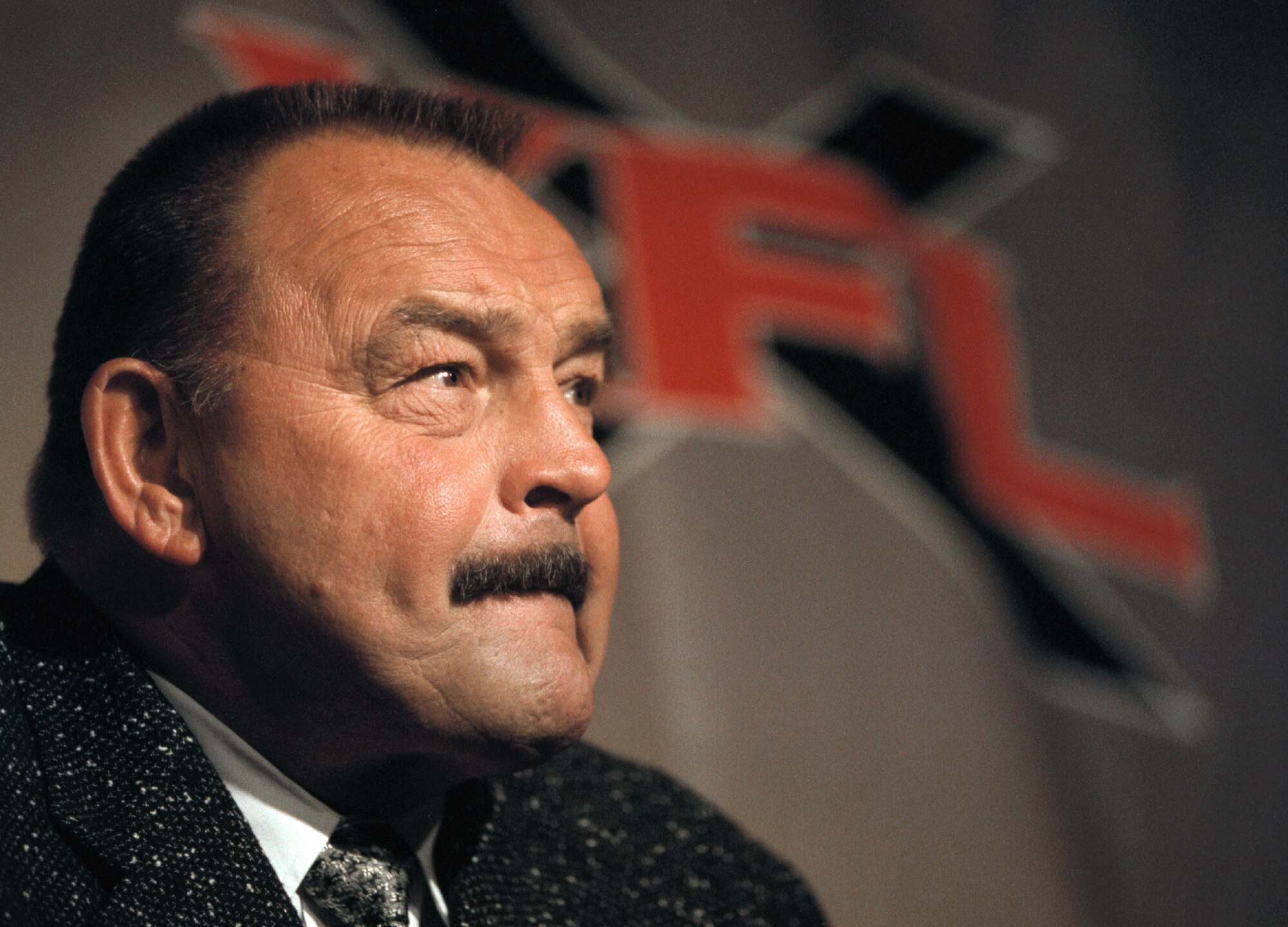 373444 03: NFL Hall of Famer and legendary Chicago Bear linebacker and actor Dick Butkus ponders a reporter's question during a press conference July 19, 2000 in Chicago, IL. Butkus was announced Head Coach of Chicago's XFL football team, and will begin p