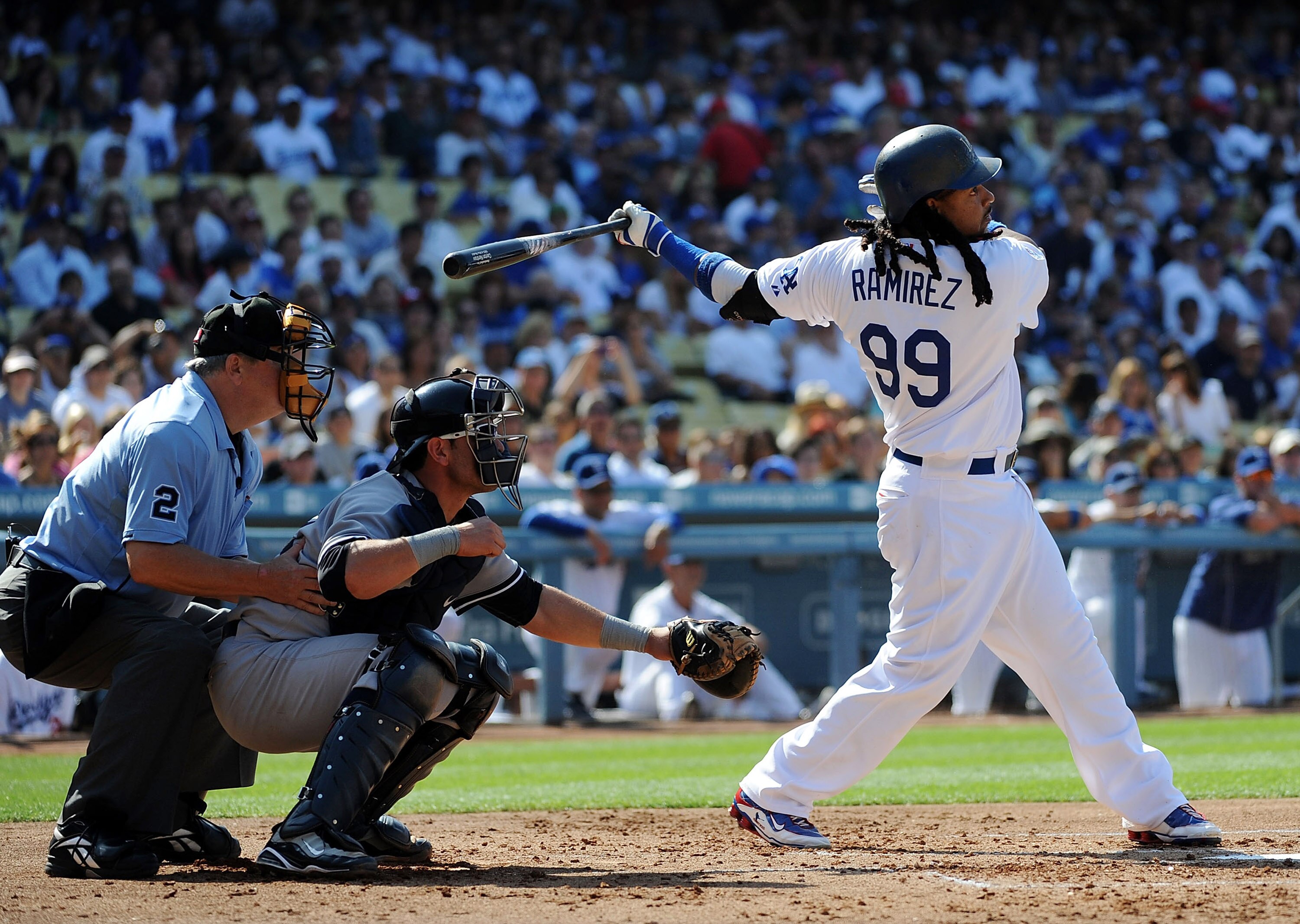 LOS ANGELES - JUNE 26:  Manny Ramirez #99 of the Los Angeles Dodgers hits a RBI double in the first inning against the New York Yankees on June 26, 2010 at Dodger Stadium in Los Angeles, California.  (Photo by Lisa Blumenfeld/Getty Images)