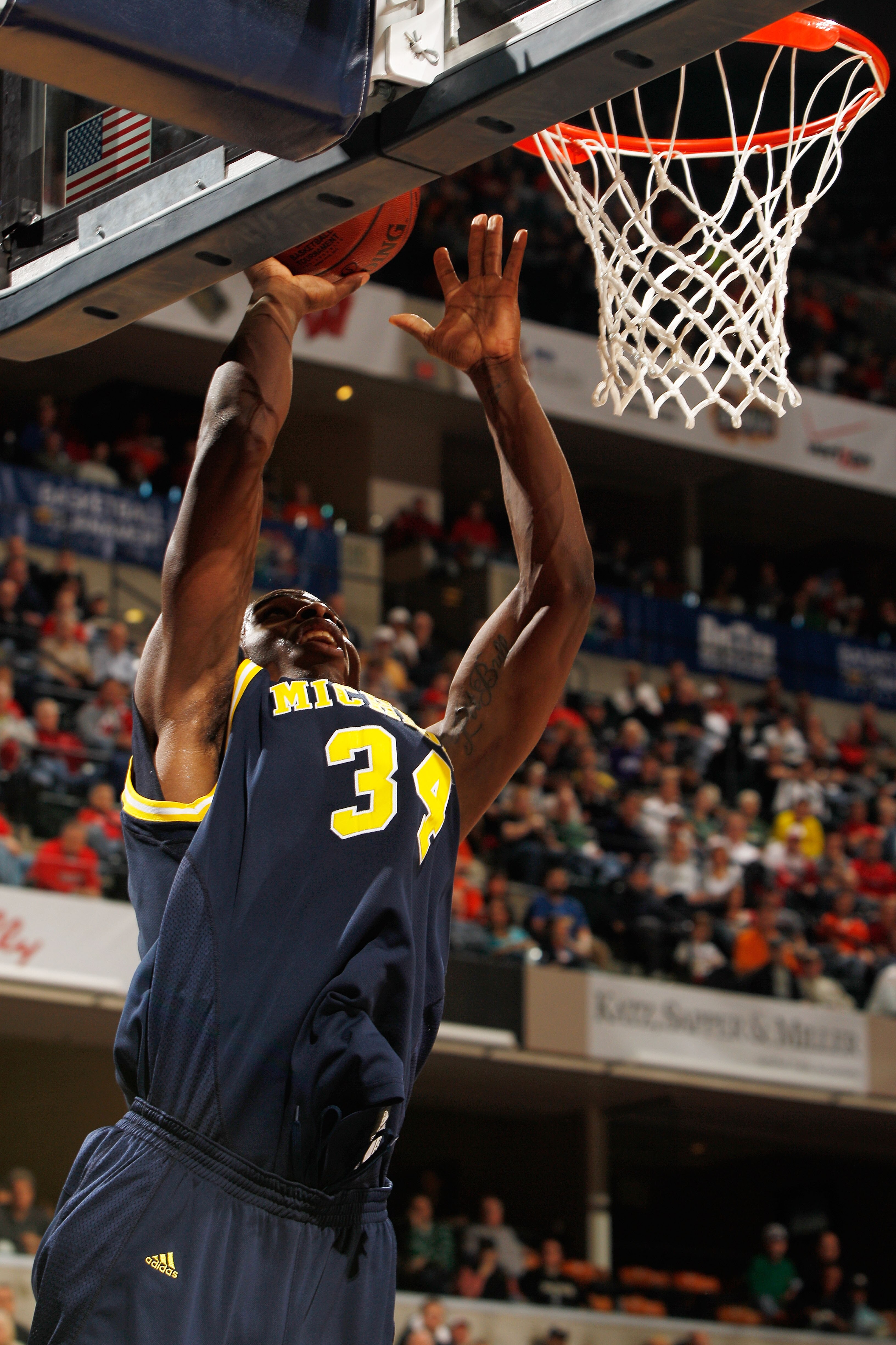 INDIANAPOLIS - MARCH 12:  Forward DeShawn Sims #34 of the Michigan Wolverines attempts a shot against the Ohio State Buckeyes during the quarterfinals of the Big Ten Men's Basketball Tournament at Conseco Fieldhouse on March 12, 2010 in Indianapolis, Indi