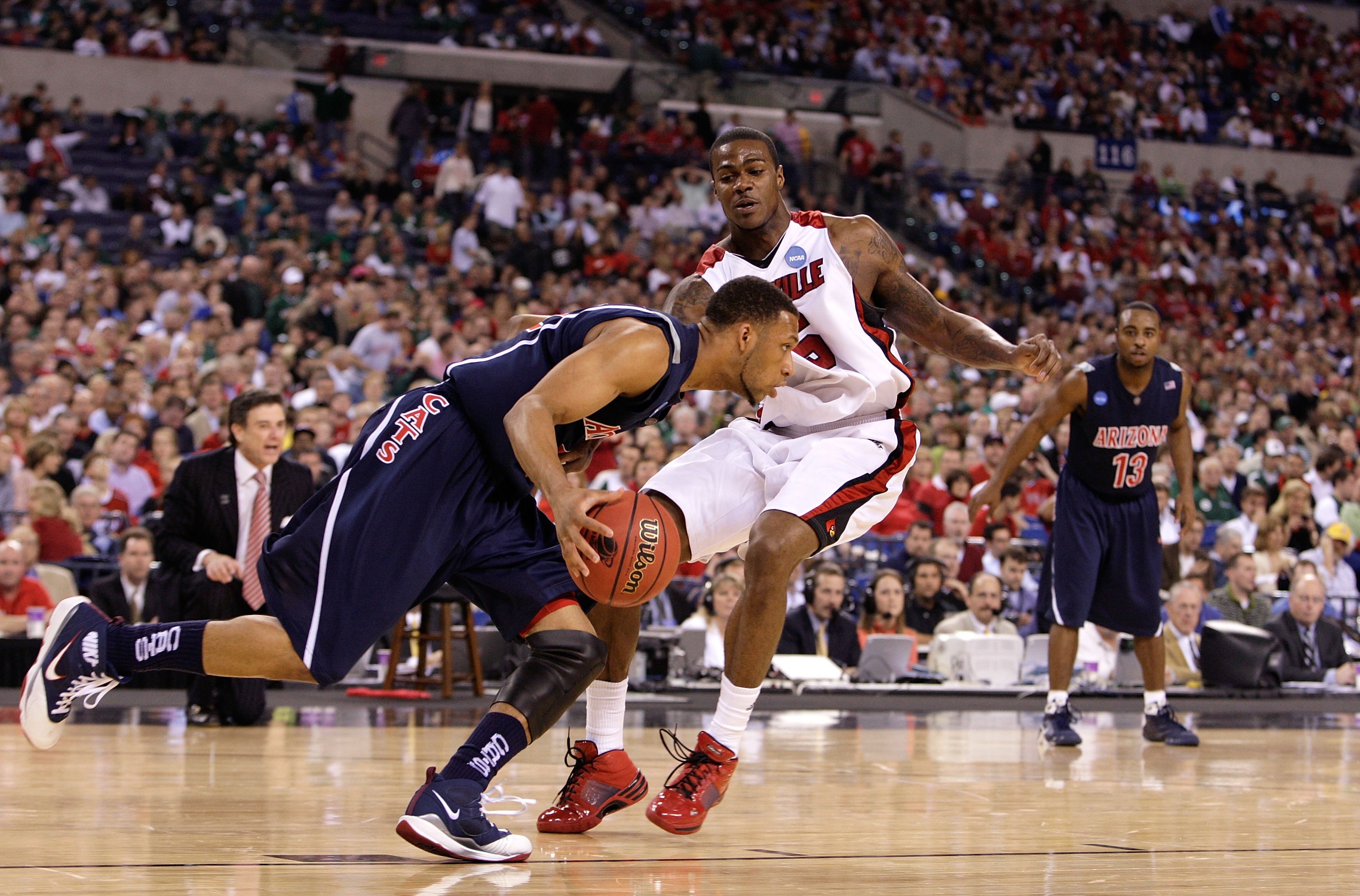 INDIANAPOLIS - MARCH 27:  Earl Clark #5 of the Louisville Cardinals defends against Jamelle Horne #42 of the Arizona Wildcats during the third round of the NCAA Division I Men's Basketball Tournament at the Lucas Oil Stadium on March 27, 2009 in Indianapo