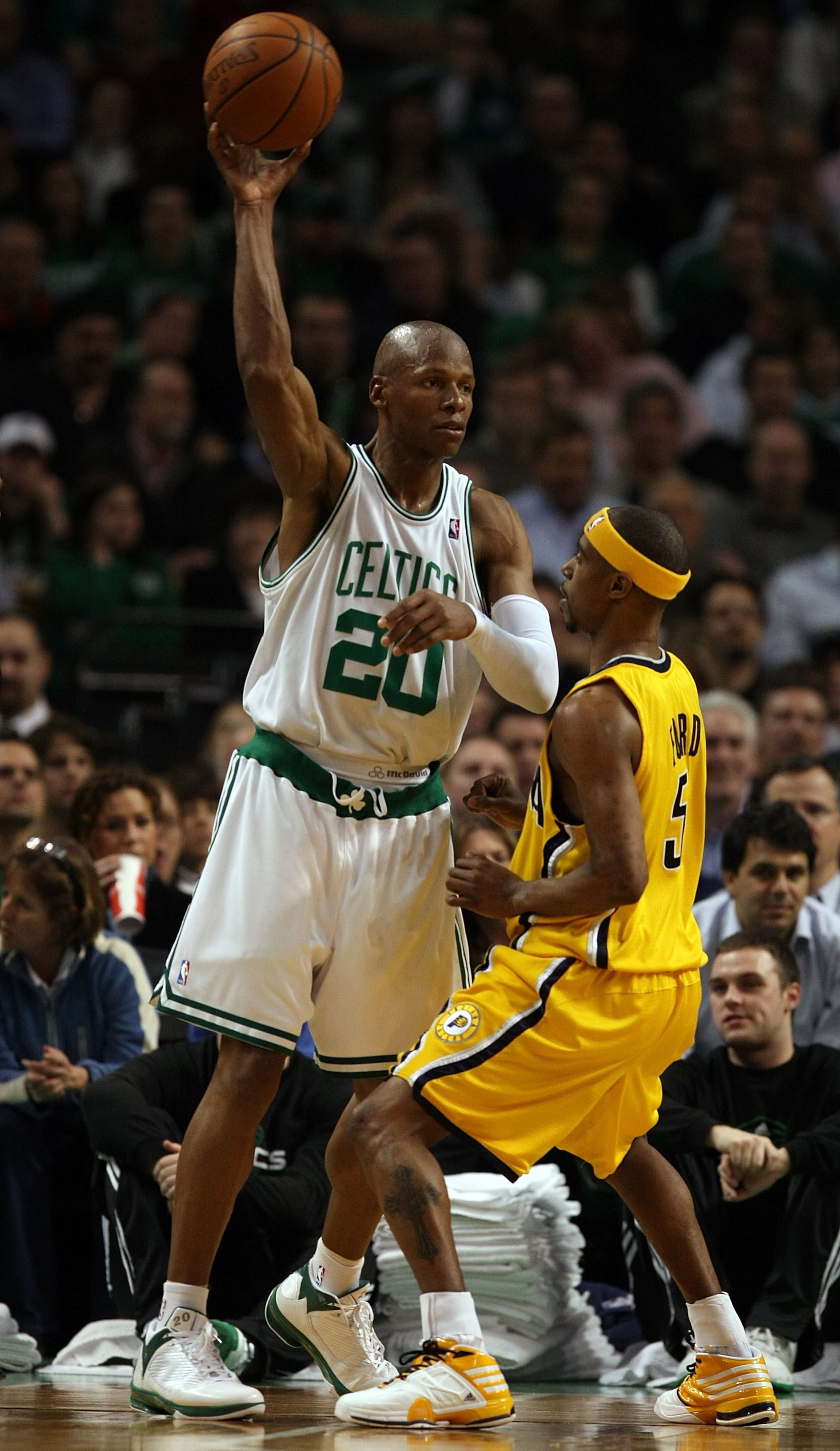 BOSTON - FEBRUARY 27:  Ray Allen #20 of the Boston Celtics passes the ball under pressure from T.J. Ford #5 of the Indiana Pacers on February 27, 2009 at TD Banknorth Garden in Boston, Massachusetts.The Celtics defeated the Pacers 104-99. NOTE TO USER: Us