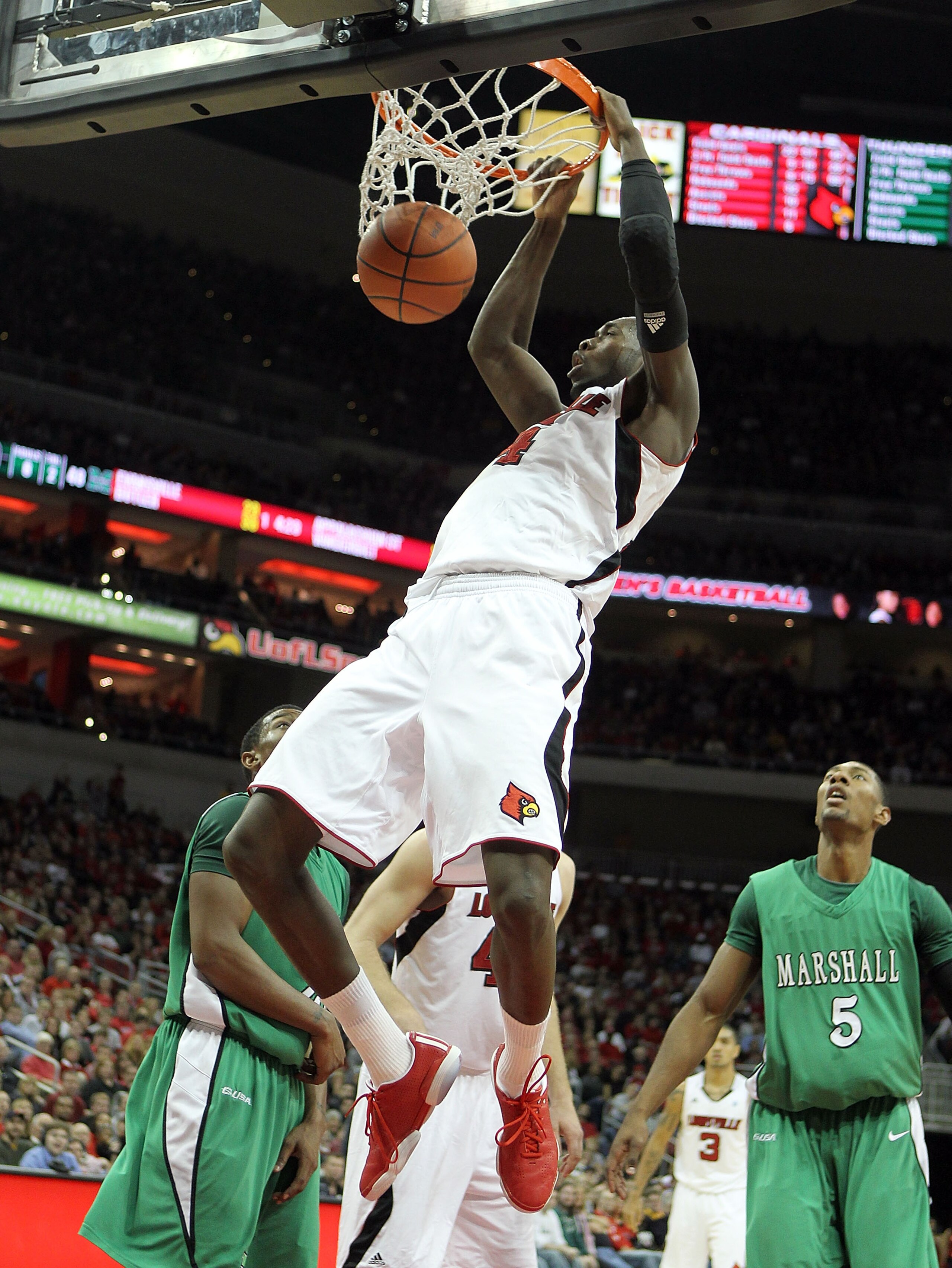 LOUISVILLE, KY - NOVEMBER 27:  Rakeem Buckles #4 of the Louisville Cardinals dunks the ball during the game against the Marshall Thundering Herd at the KFC Yum! Center on November 27, 2010 in Louisville, Kentucky. Louisville won 80-66.  (Photo by Andy Lyo