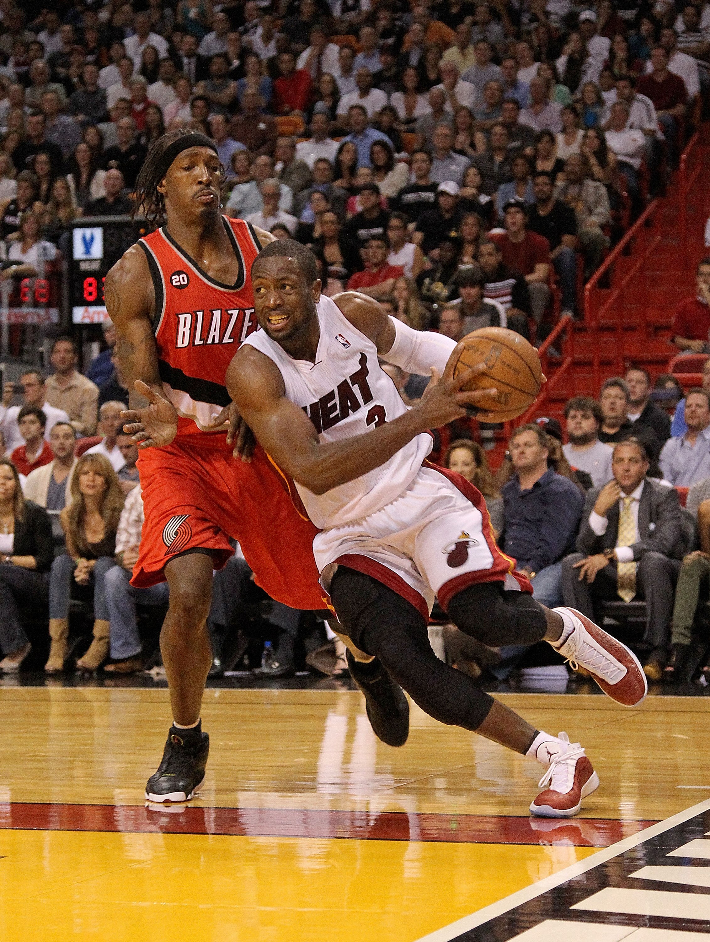 MIAMI, FL - MARCH 08:  Dwyane Wade #3 of the Miami Heat drives on  Gerald Wallace #3 of the Portland Trail Blazers during a game at American Airlines Arena on March 8, 2011 in Miami, Florida. NOTE TO USER: User expressly acknowledges and agrees that, by d