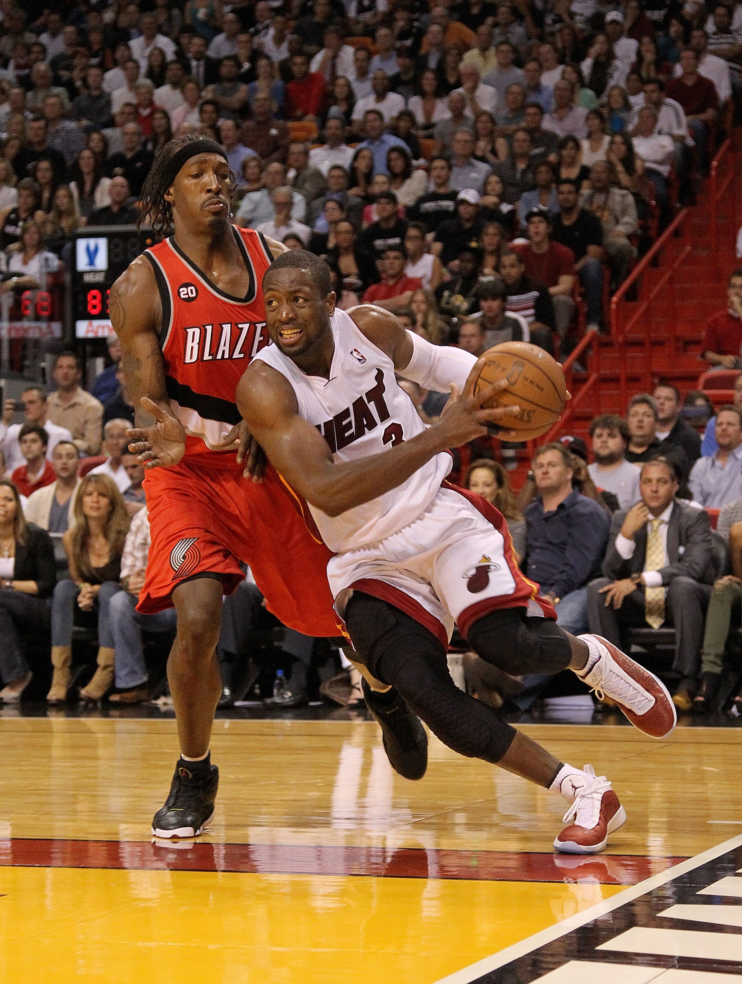 MIAMI, FL - MARCH 08: Dwyane Wade #3 of the Miami Heat drives on Gerald Wallace #3 of the Portland Trail Blazers during a game at American Airlines Arena on March 8, 2011 in Miami, Florida. NOTE TO USER: User expressly acknowledges and agrees that, by d MIAMI, FL - MARCH 08: Dwyane Wade #3 of the Miami Heat drives on Gerald Wallace #3 of the Portland Trail Blazers during a game at American Airlines Arena on March 8, 2011 in Miami, Florida. NOTE TO USER: User expressly acknowledges and agrees that, by d