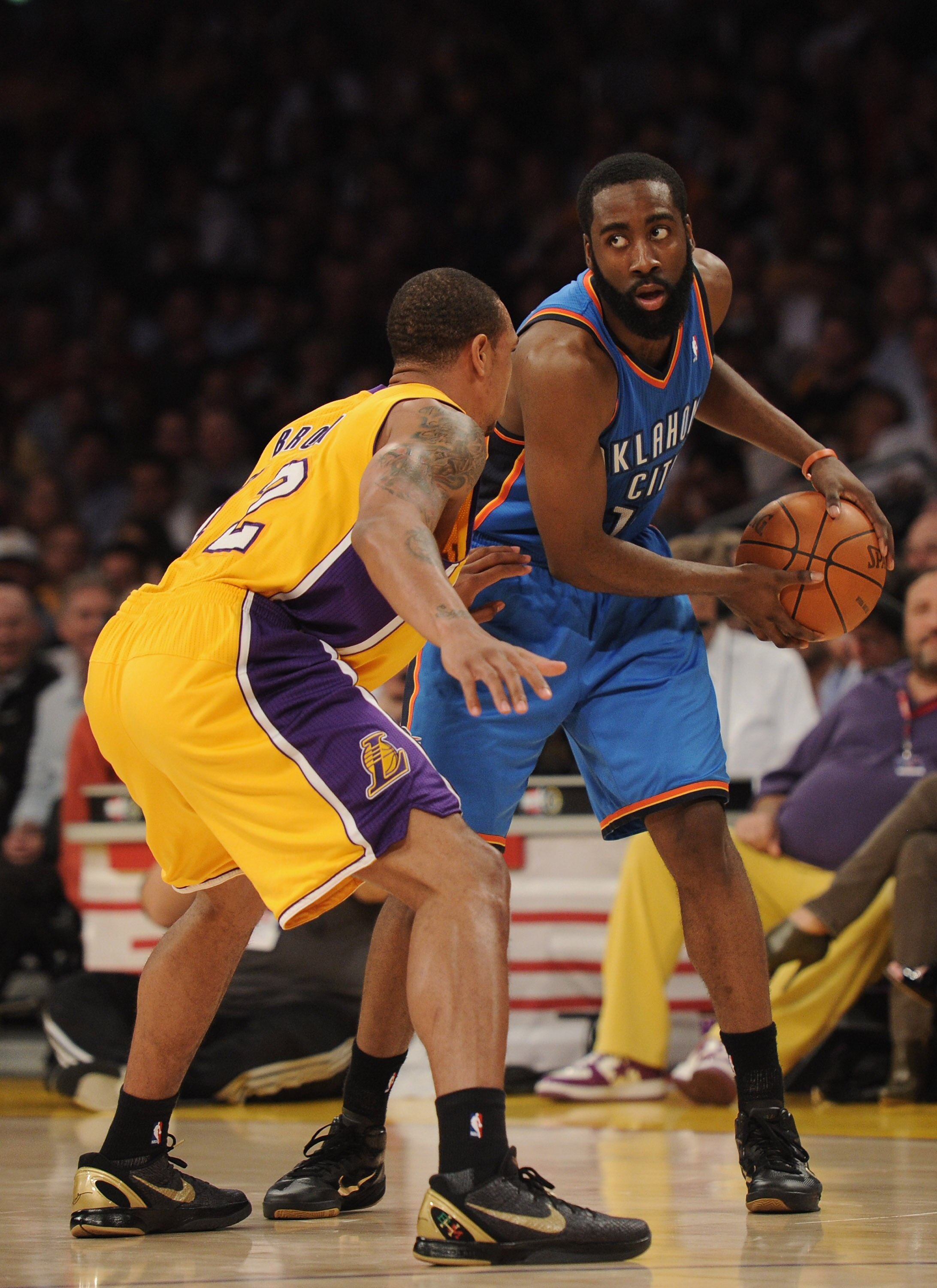 LOS ANGELES, CA - JANUARY 17:  James Harden #13 of the Oklahoma City Thunder is guarded by Derek Fisher #2 of the Los Angeles Lakers at the Staples Center on January 17, 2011 in Los Angeles, California.   NOTE TO USER: User expressly acknowledges and agre