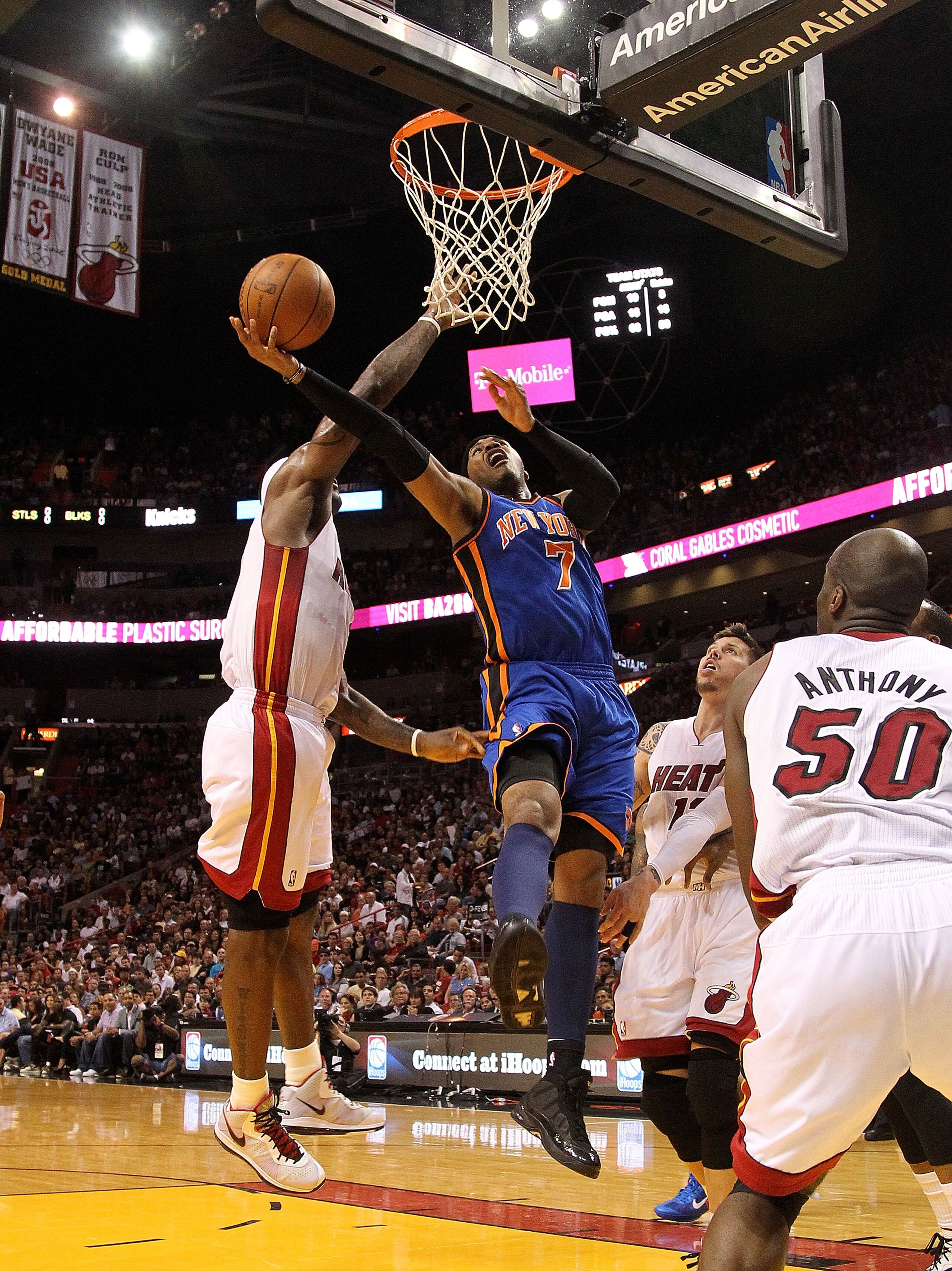 MIAMI, FL - FEBRUARY 27: Carmelo Anthony #7 of the New York Knicks shoots around LeBron James #6 of the Miami Heat during a game at American Airlines Arena on February 27, 2011 in Miami, Florida. NOTE TO USER: User expressly acknowledges and agrees that, MIAMI, FL - FEBRUARY 27: Carmelo Anthony #7 of the New York Knicks shoots around LeBron James #6 of the Miami Heat during a game at American Airlines Arena on February 27, 2011 in Miami, Florida. NOTE TO USER: User expressly acknowledges and agrees that,