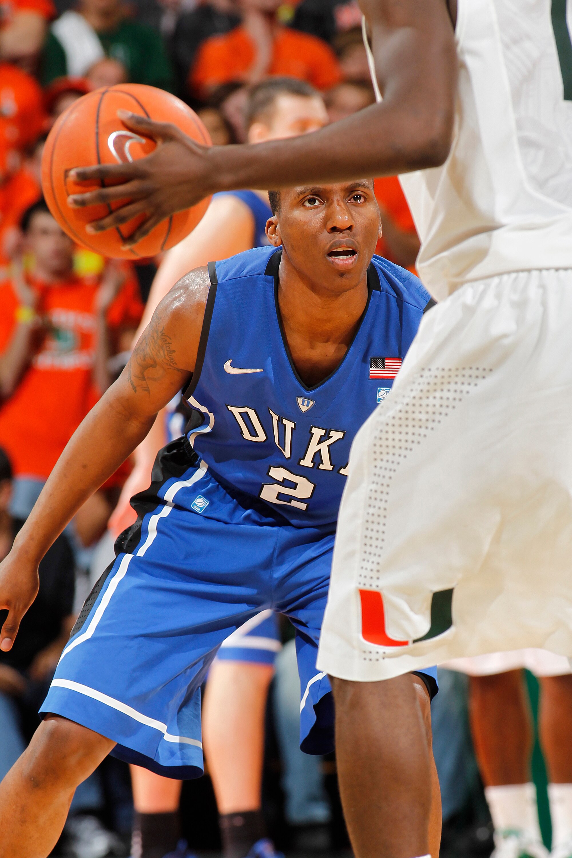 CORAL GABLES, FL - FEBRUARY 13: Nolan Smith #2 of the Duke Blue Devils defends against Durand Scott #1 of the Miami Hurricanes on February 13, 2011 at the BankUnited Center in Coral Gables, Florida. (Photo by Joel Auerbach/Getty Images)