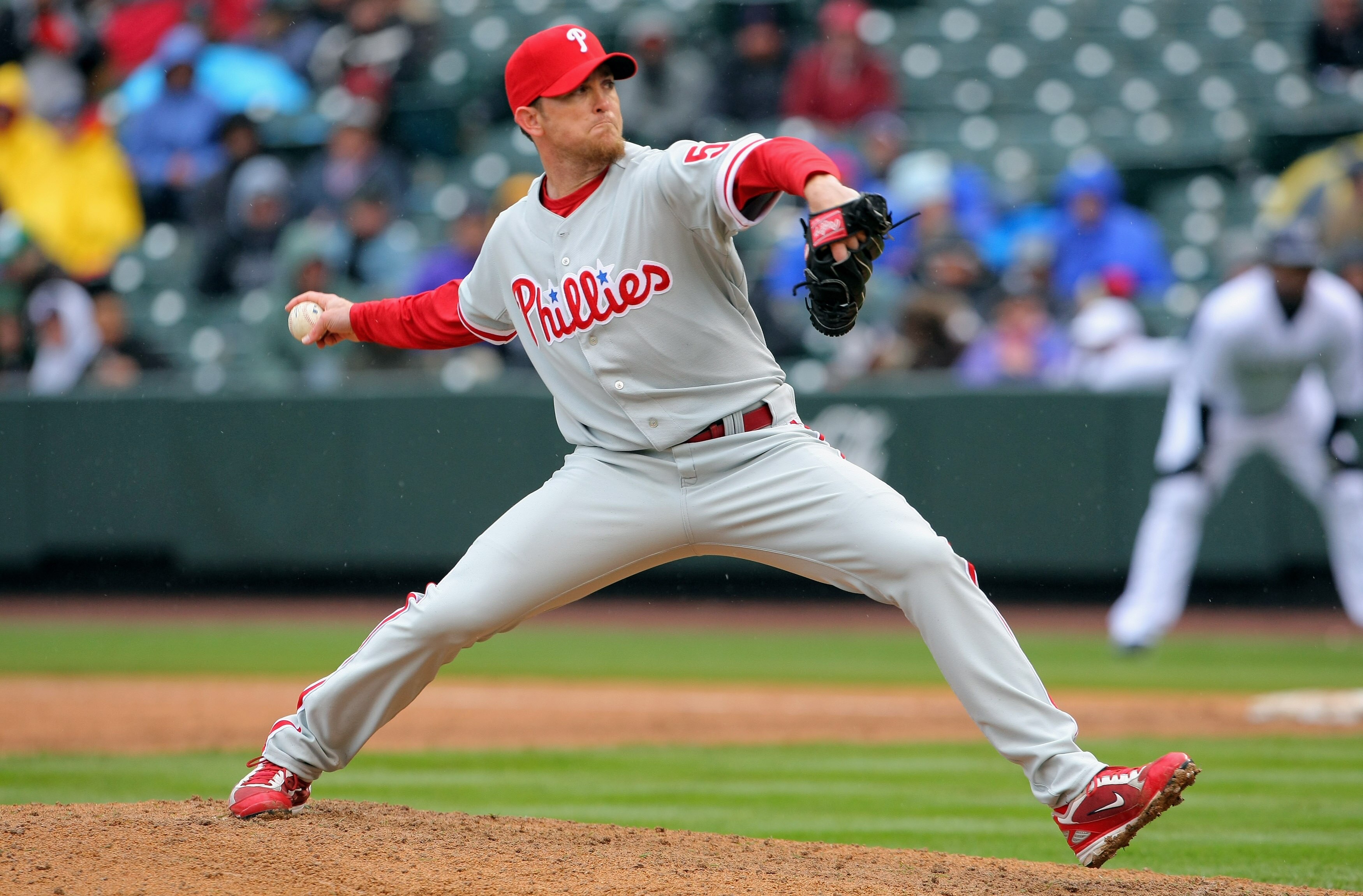 DENVER - APRIL 12:  Pitcher Brad Lidge #54 of the Philadelphia Phillies pitches the ninth inning against the Colorado Rockies at Coors Field on April 12, 2009 in Denver, Colorado. Lidge earned the save as the Phillies defeated the Rockies 7-5.  (Photo by