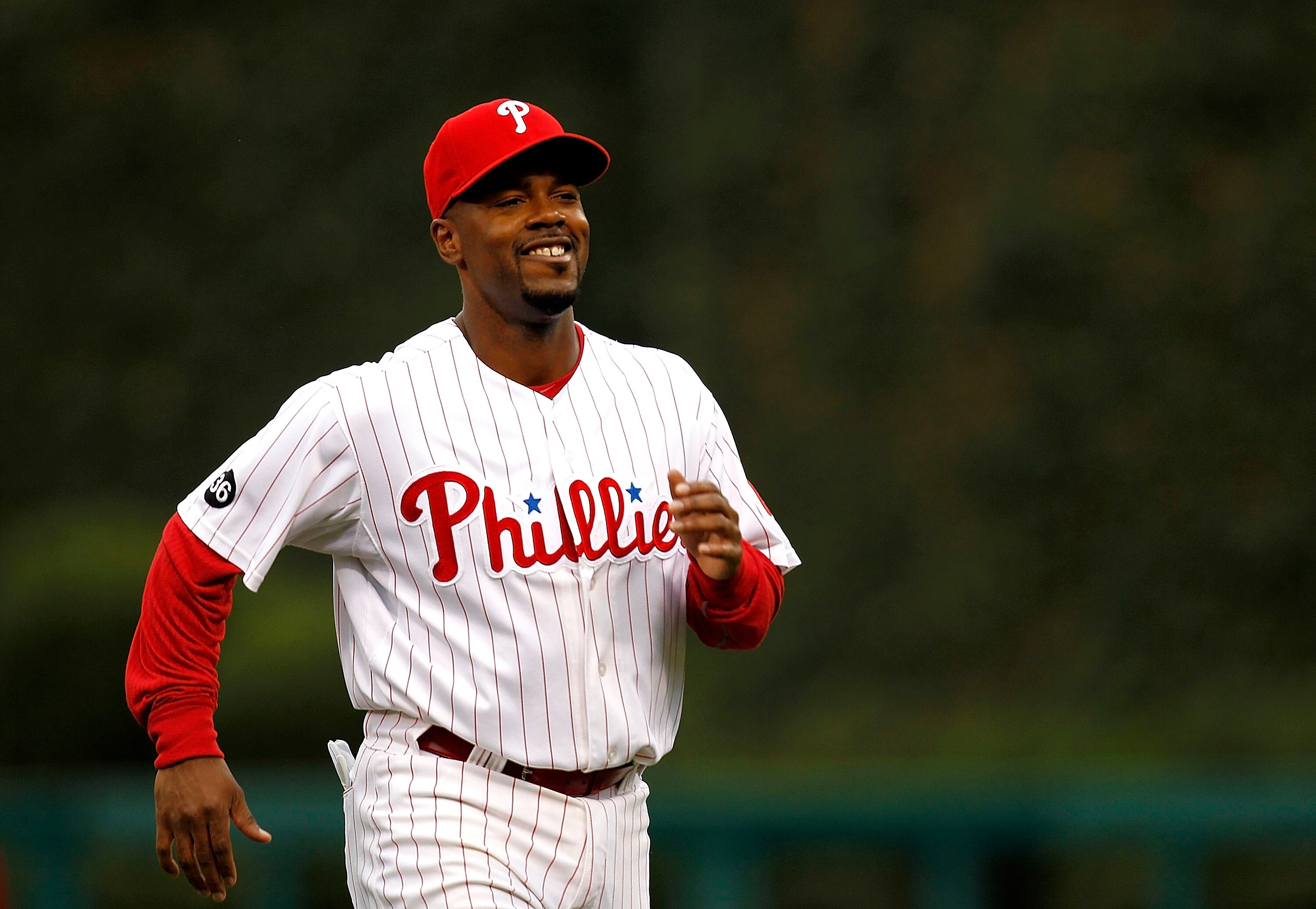 PHILADELPHIA - OCTOBER 06:  Jimmy Rollins #11 of the Philadelphia Phillies warms up before Game 1 of the NLDS against the Cincinnati Reds at Citizens Bank Park on October 6, 2010 in Philadelphia, Pennsylvania.  (Photo by Jeff Zelevansky/Getty Images)