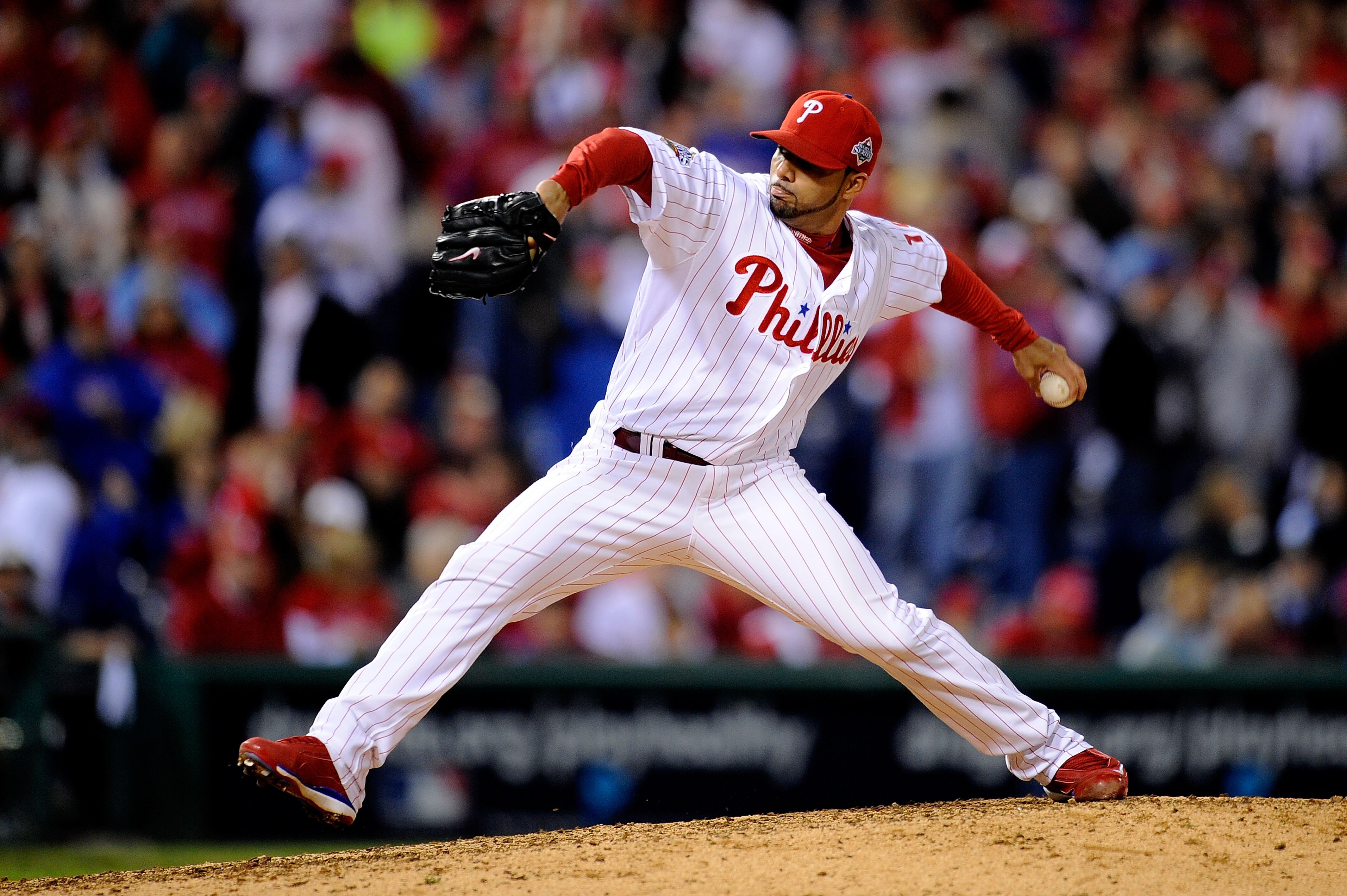 PHILADELPHIA - OCTOBER 26:  J.C. Romero #16 of the Philadelphia Phillies pitches against the Tampa Bay Rays to win game four of the 2008 MLB World Series on October 26, 2008 at Citizens Bank Park in Philadelphia, Pennsylvania.  (Photo by Jeff Zelevansky/G