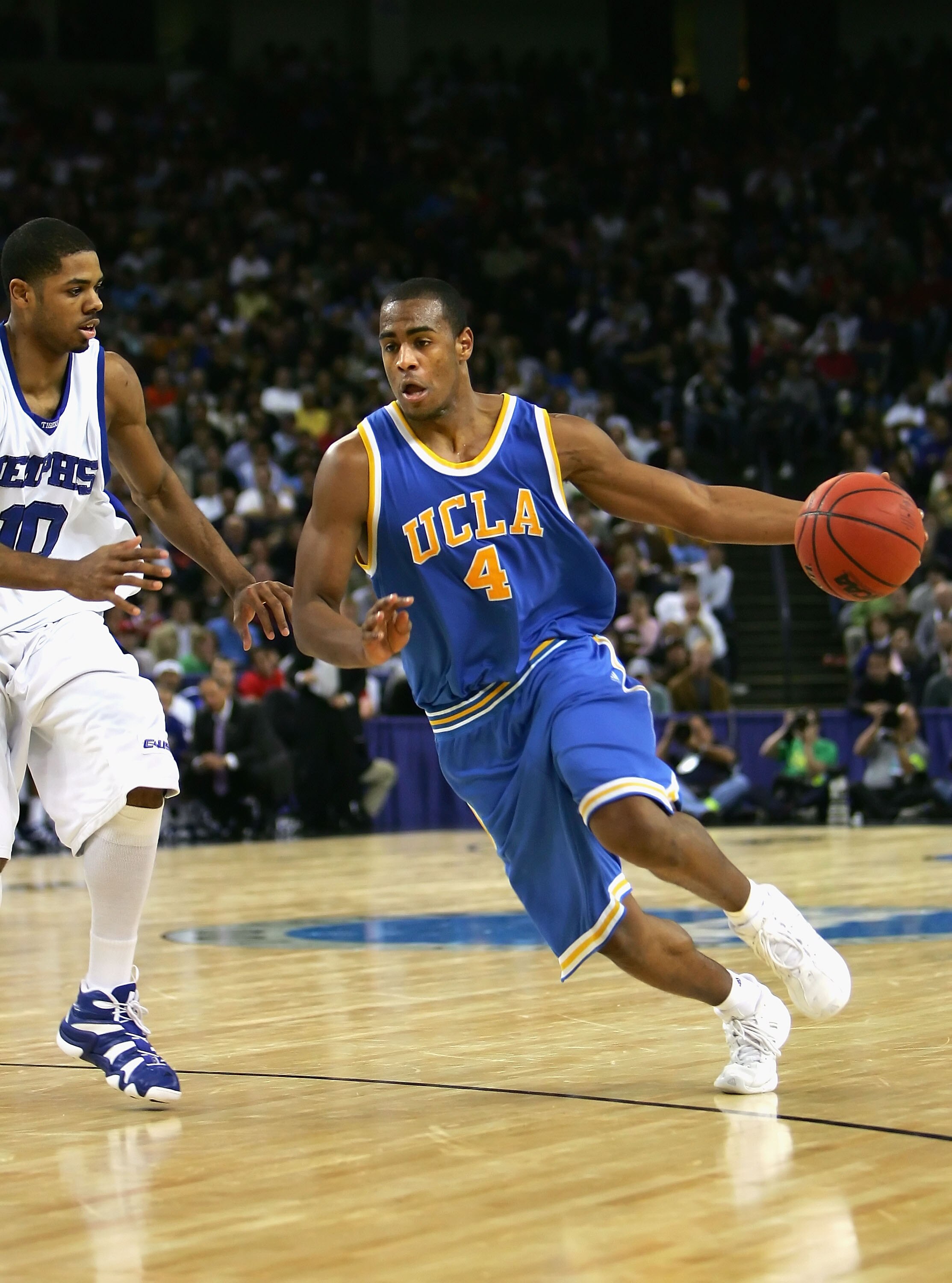 OAKLAND, CA - MARCH 25:  Arron Afflalo #4 of the UCLA Bruins handles the ball against the Memphis Tigers during the third round game of the NCAA Division I Men's Basketball Tournament at the Arena in Oakland on March 25, 2006 in Oakland, California.  (Pho