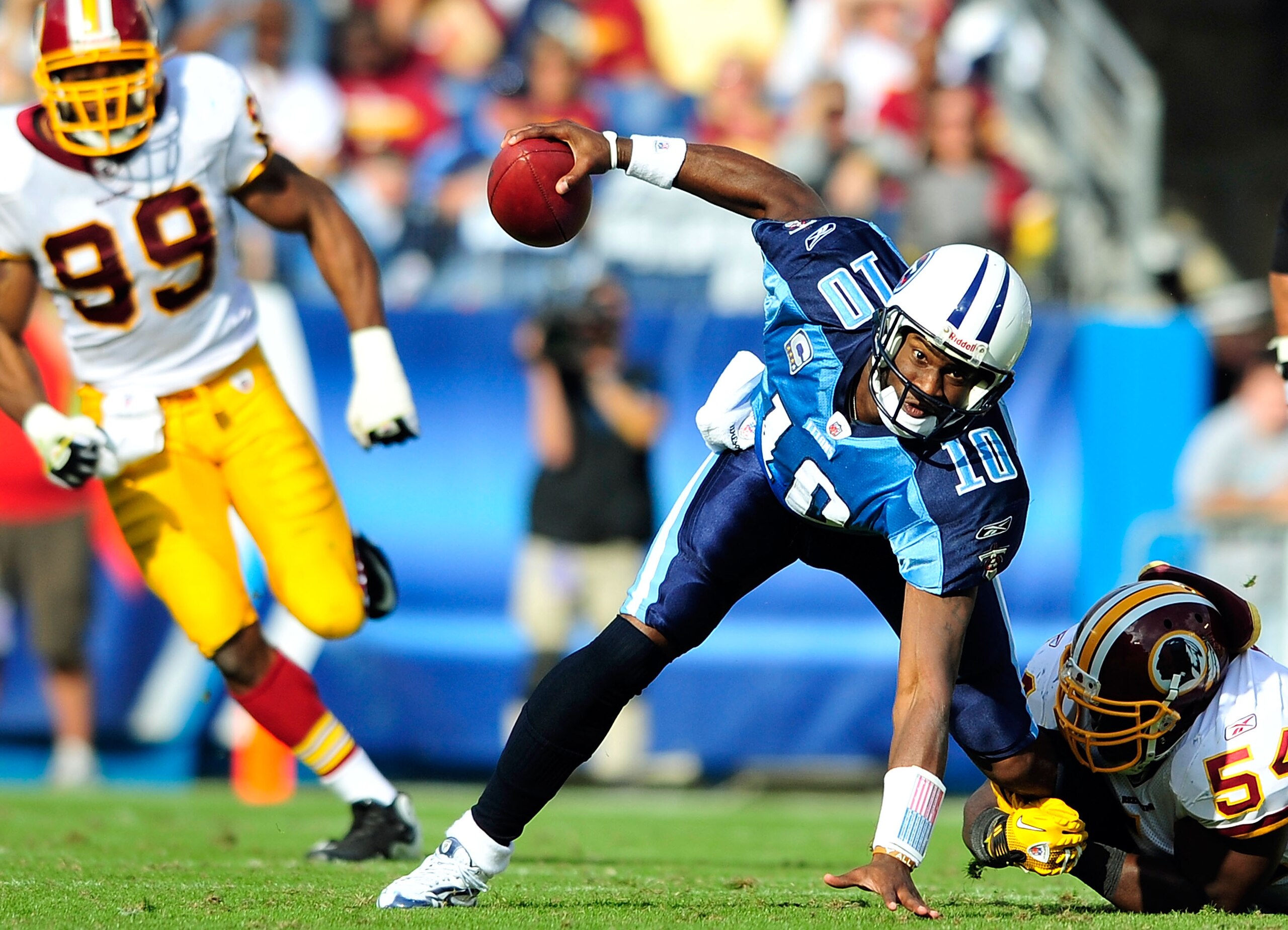 NASHVILLE, TN - NOVEMBER 21:  Quarterback Vince Young #10 of the Tennessee Titans scrambles away from H.B. Blades #54 of the Washington Redskins at LP Field on November 21, 2010 in Nashville, Tennessee. The Redskins won 19-16 in overtime.  (Photo by Grant