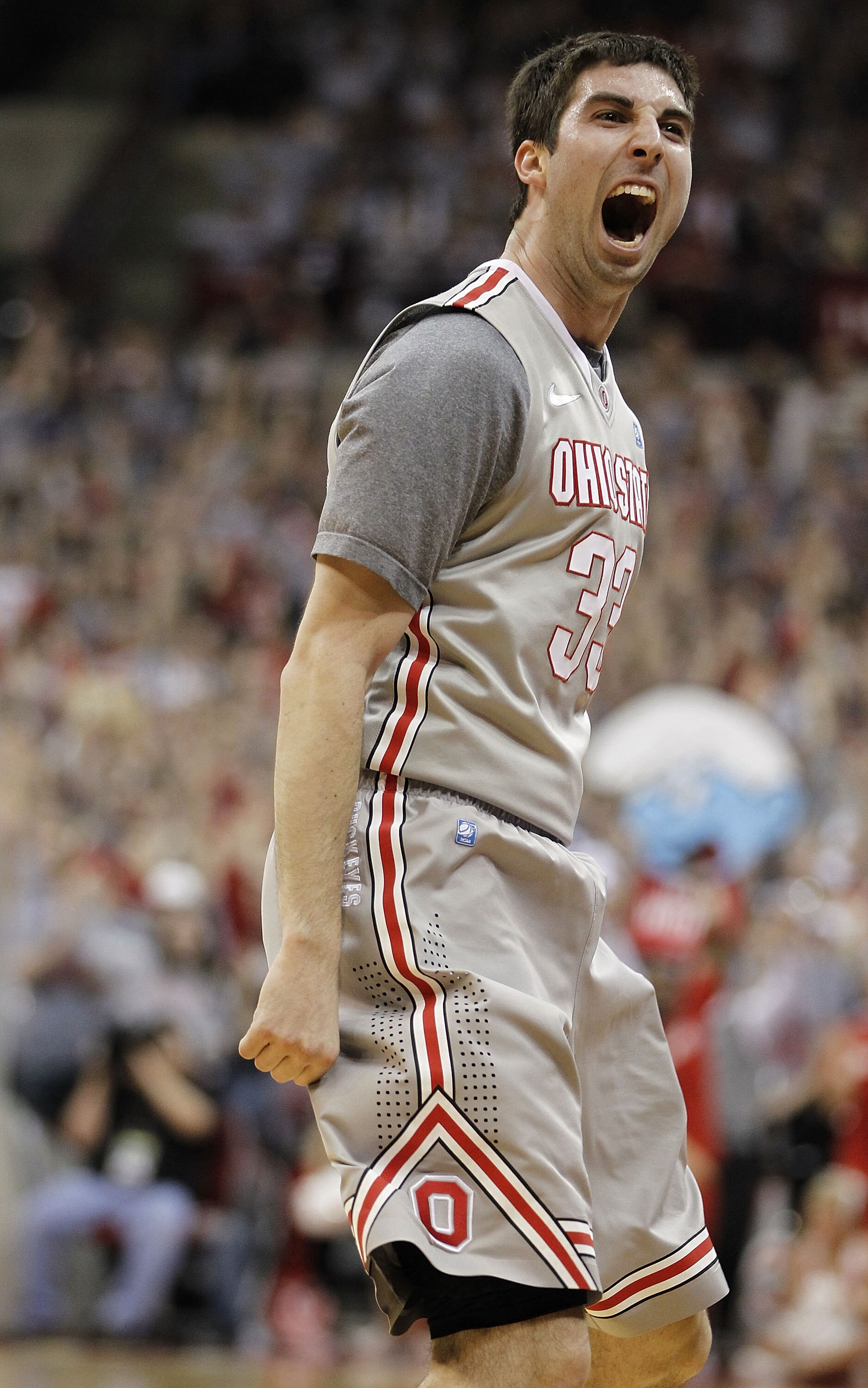 COLUMBUS, OH - MARCH 06:  Jon Diebler #33 of the Ohio State Buckeyes reacts after making a second half three point basket while playing the Wisconsin Badgers on March 6, 2011 at the Value City Arena in Columbus, Ohio. Ohio State won the game 93-65. (Photo