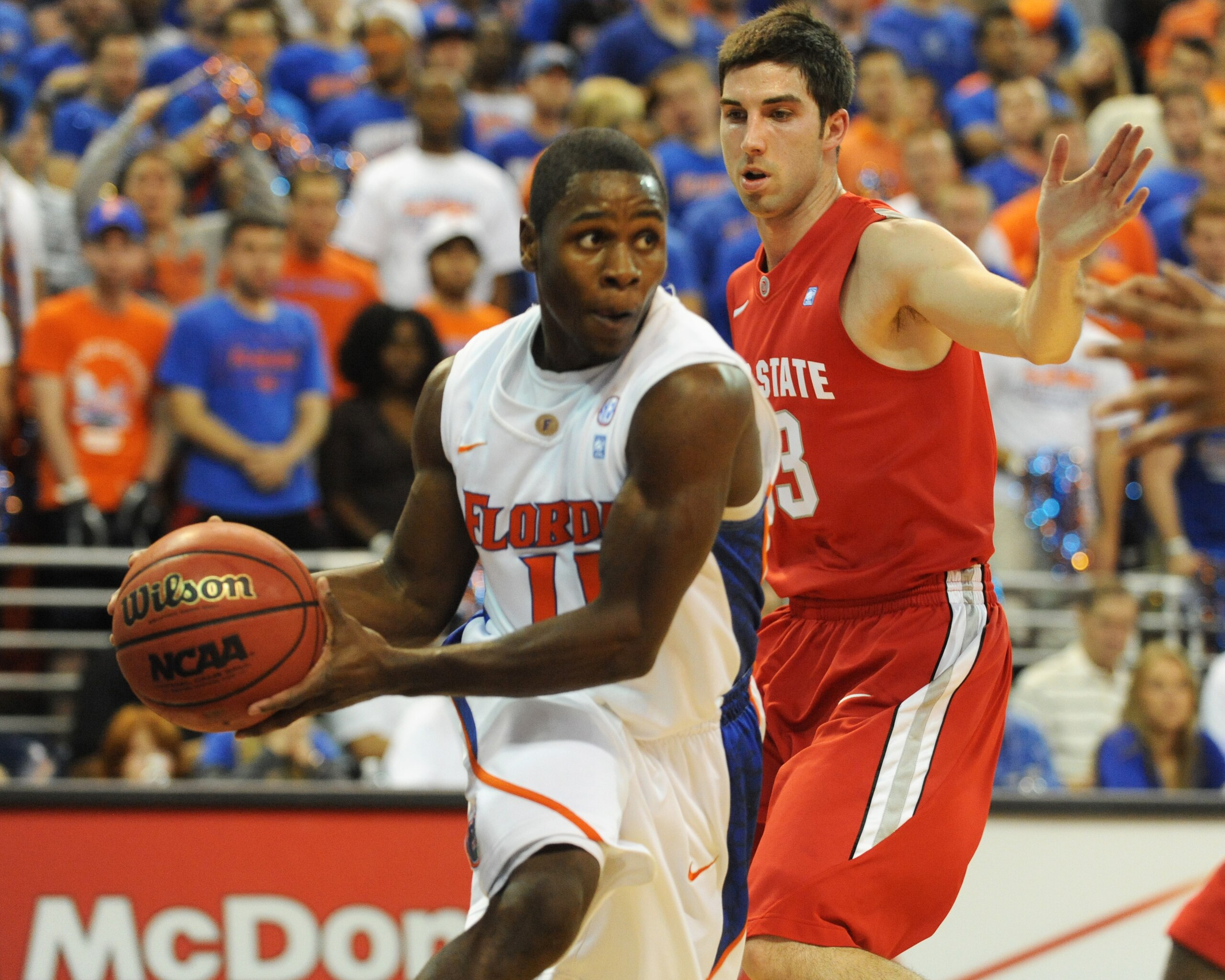 GAINESVILLE, FL - NOVEMBER 16: Guard Erving Walker #11 of the Florida Gators looks to pass against the Ohio State Buckeyes November 16, 2010 at the Stephen C. O'Connell Center in Gainesville, Florida.  (Photo by Al Messerschmidt/Getty Images)