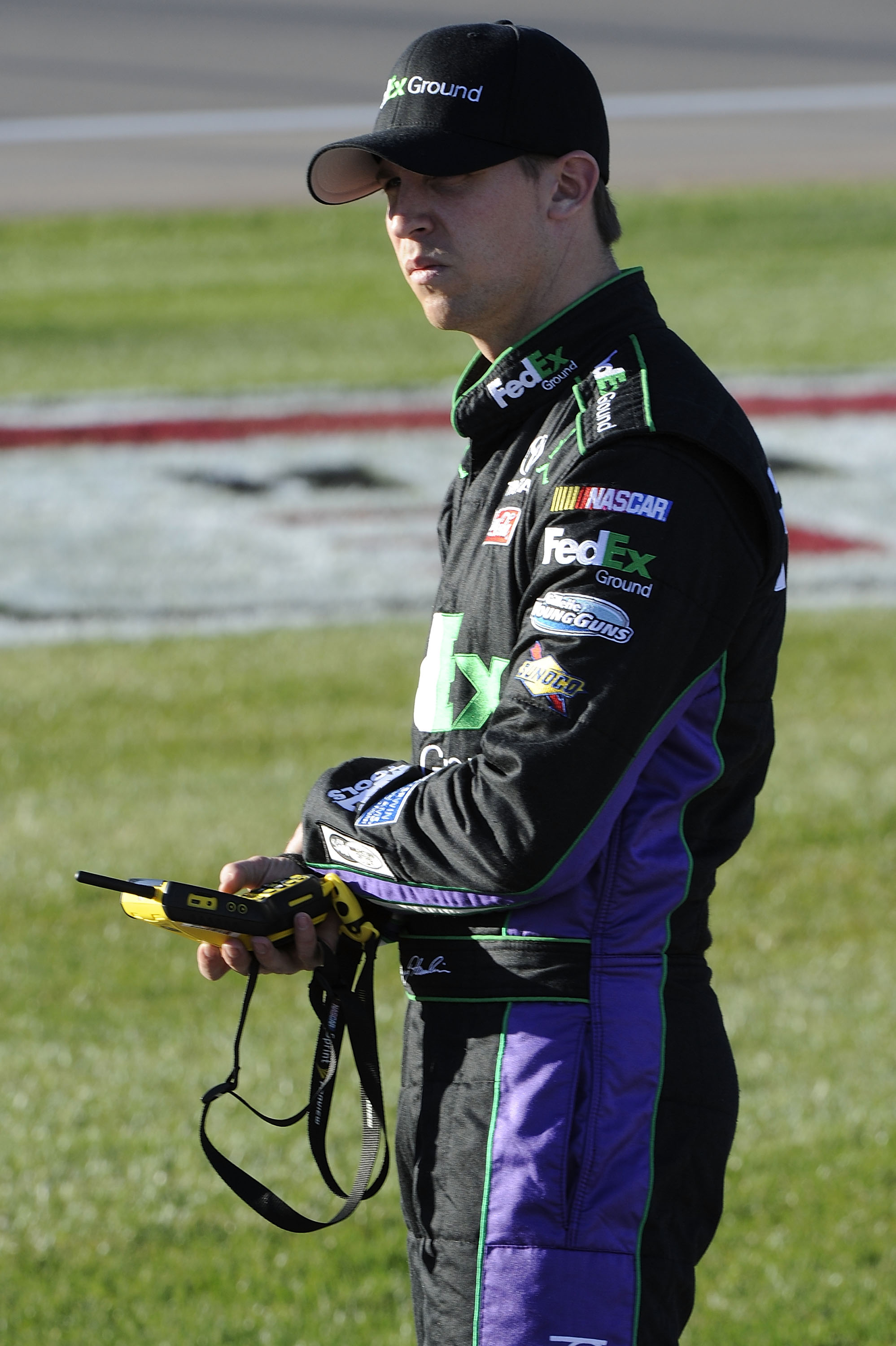 LAS VEGAS, NV - MARCH 04:  Denny Hamlin, driver of the #11 FedEx Ground Toyota, waits on the grid during qualifying for the NASCAR Sprint Cup Series Kobalt Tools 400 at Las Vegas Motor Speedway on March 4, 2011 in Las Vegas, Nevada.  (Photo by John Harrel