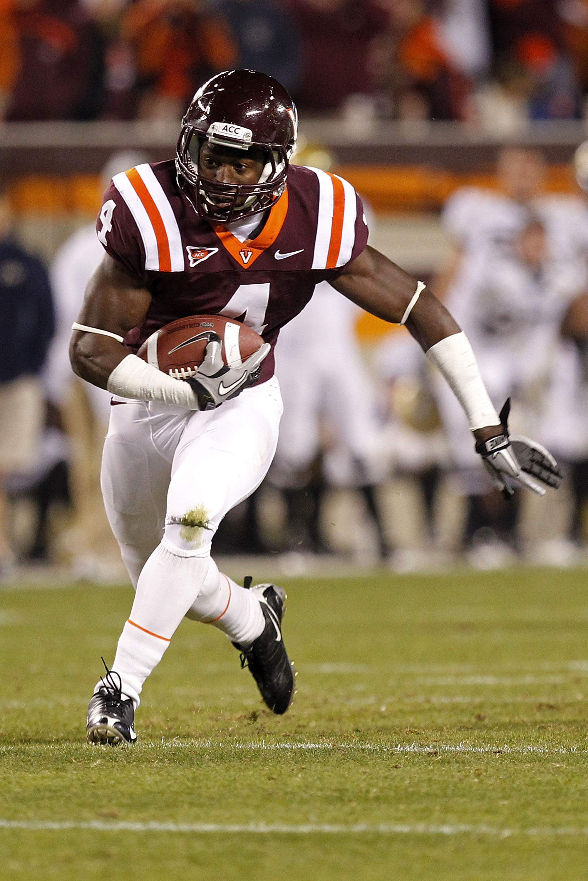 BLACKSBURG, VA - NOVEMBER 04:  Running back David Wilson #4 of the Virginia Tech Hokies runs with the ball against the Georgia Tech Yellow Jackets at Lane Stadium on November 4, 2010 in Blacksburg, Virginia.  (Photo by Geoff Burke/Getty Images)