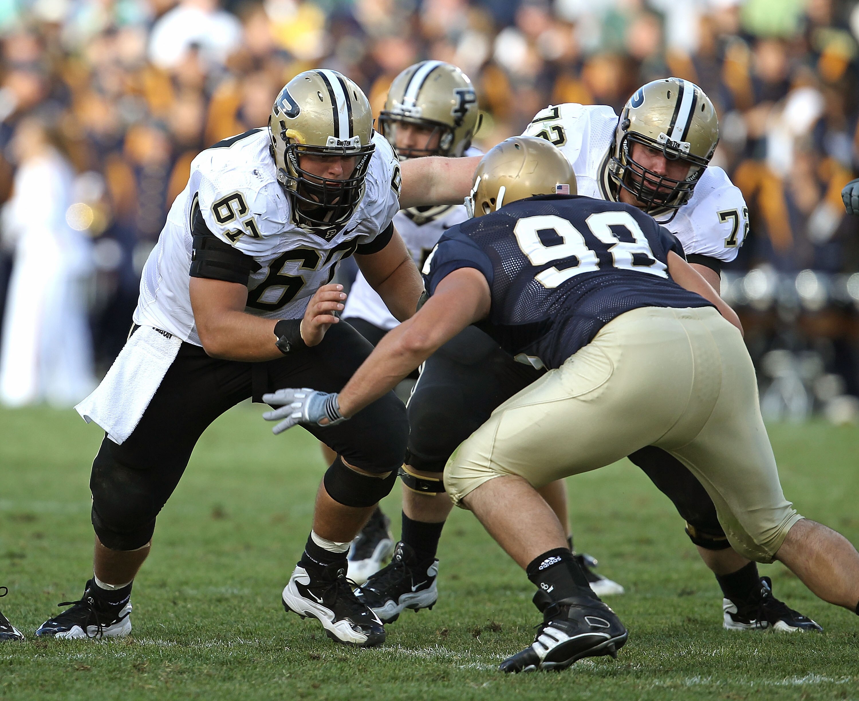 SOUTH BEND, IN - SEPTEMBER 04: Peters Drey #67 and Justin Pierce #72 of the Purdue Boilermakers move to block Sean Cwynar #98 of the Notre Dame Fighting Irish at Notre Dame Stadium on September 4, 2010 in South Bend, Indiana. Notre Dame defeated Purdue 23