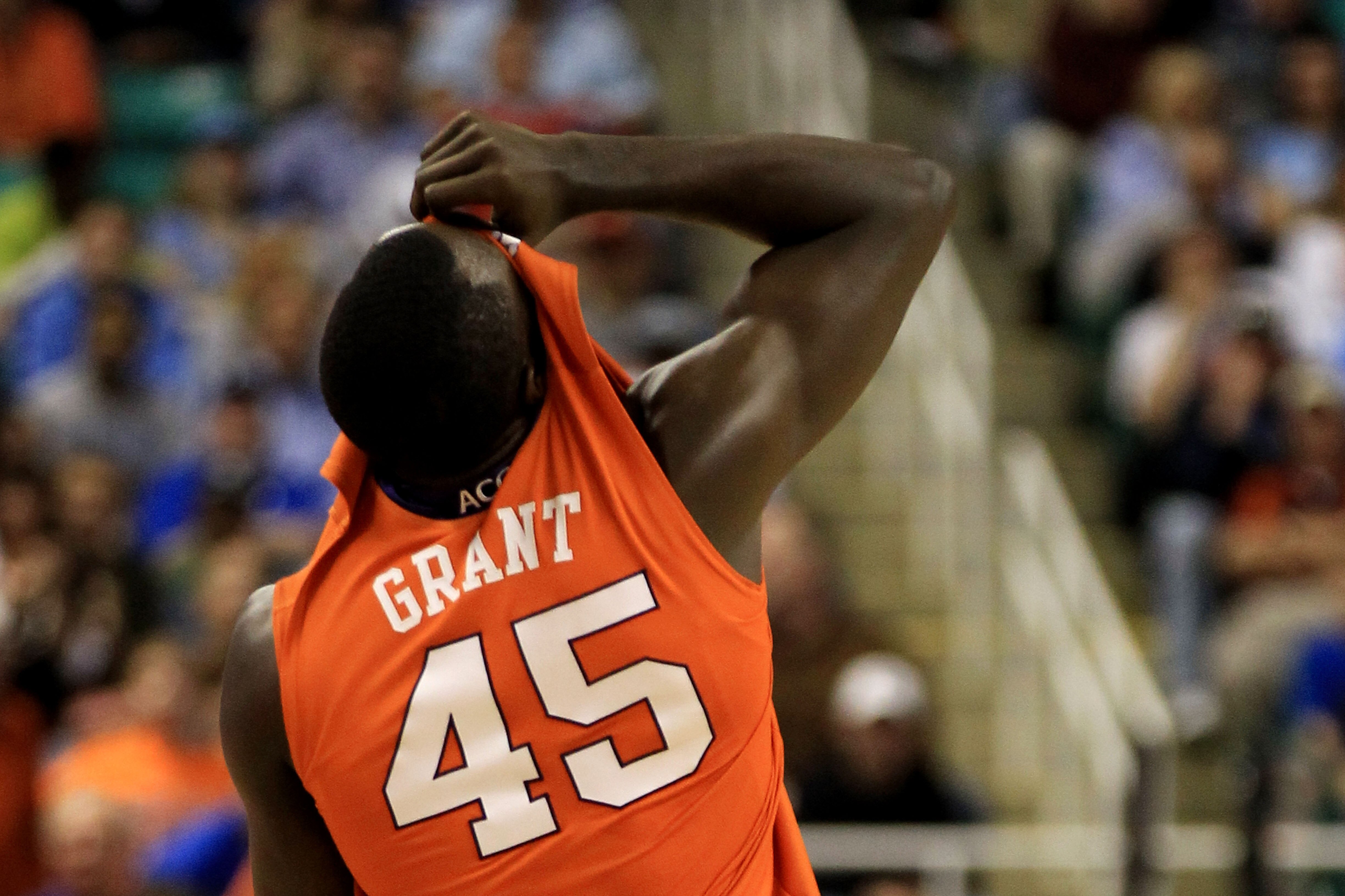 GREENSBORO, NC - MARCH 12:  Jerai Grant #45 of the Clemson Tigers reacts by putting his shirt over his face while playing against the North Carolina Tar Heels in the semifinals of the 2011 ACC men's basketball tournament at the Greensboro Coliseum on Marc