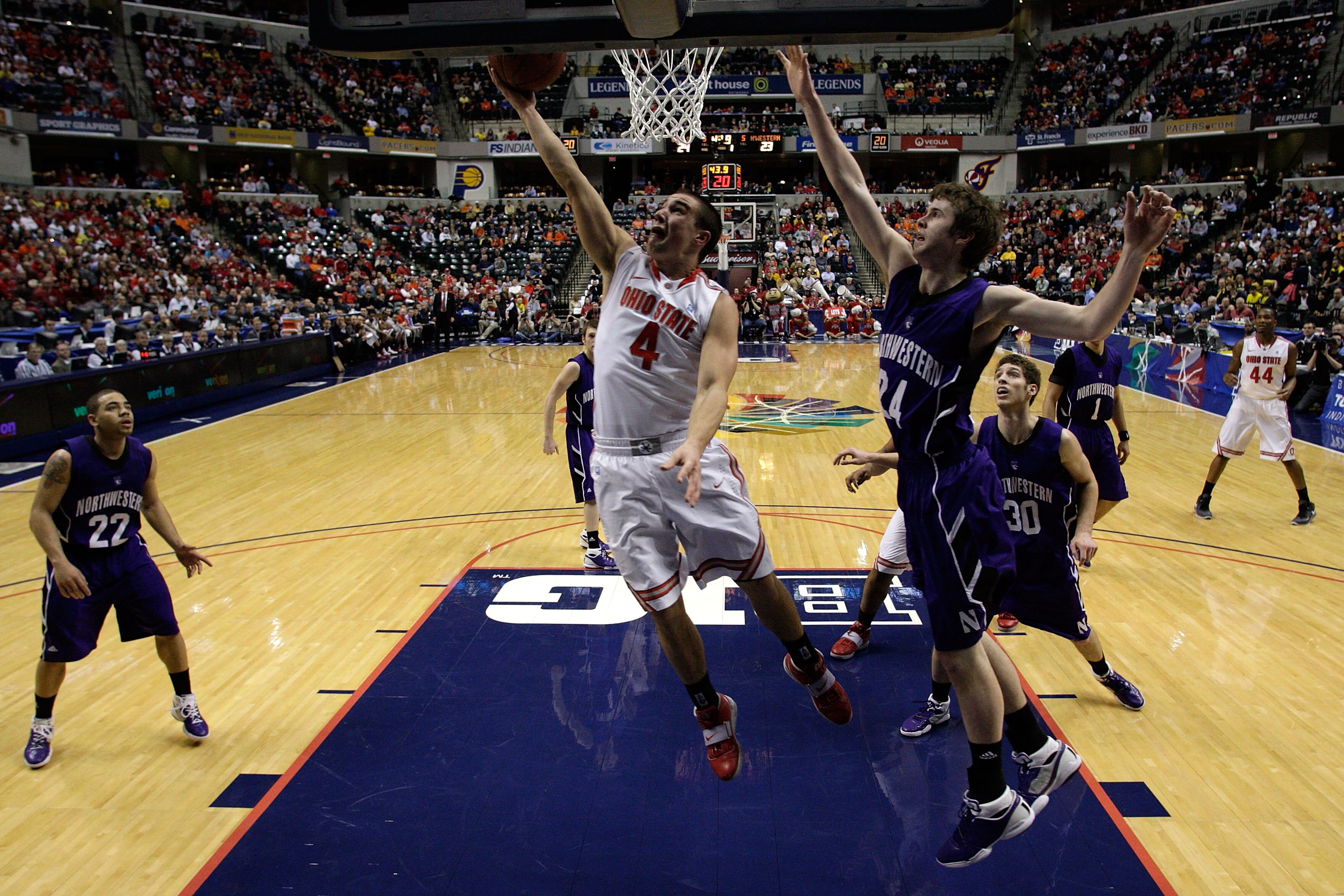 INDIANAPOLIS, IN - MARCH 11:  Aaron Craft #4 of the Ohio State Buckeyes drives for a shot attempt against John Shurna #24 of the Northwestern Wildcats during the quarterfinals of the 2011 Big Ten Men's Basketball Tournament at Conseco Fieldhouse on March