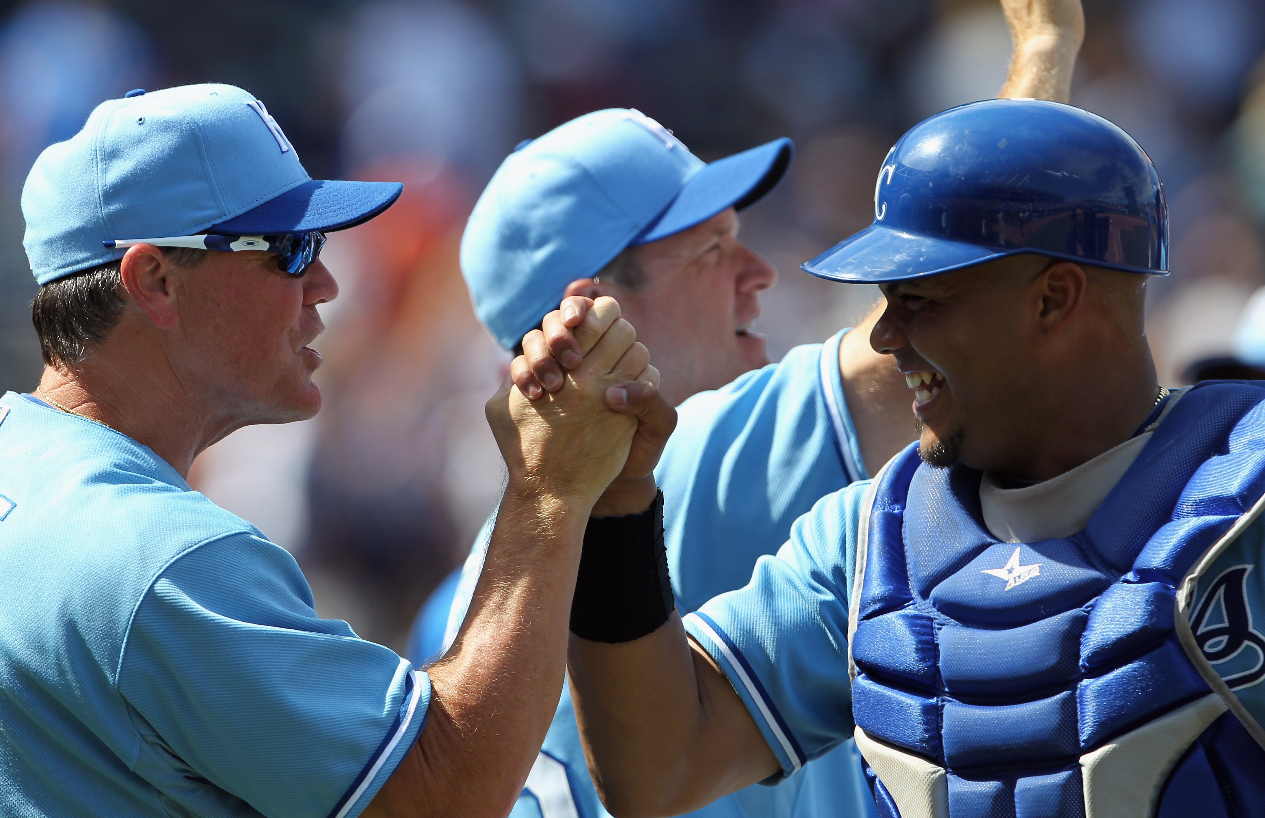KANSAS CITY, MO - AUGUST 15:  Manager Ned Yost #2 of the Kansas City Royals congratulates catcher Brayan Pena #27 after the Royals defeated the New York Yankees 1-0 on August 15, 2010 at Kauffman stadium in Kansas City, Missouri.  (Photo by Jamie Squire/G
