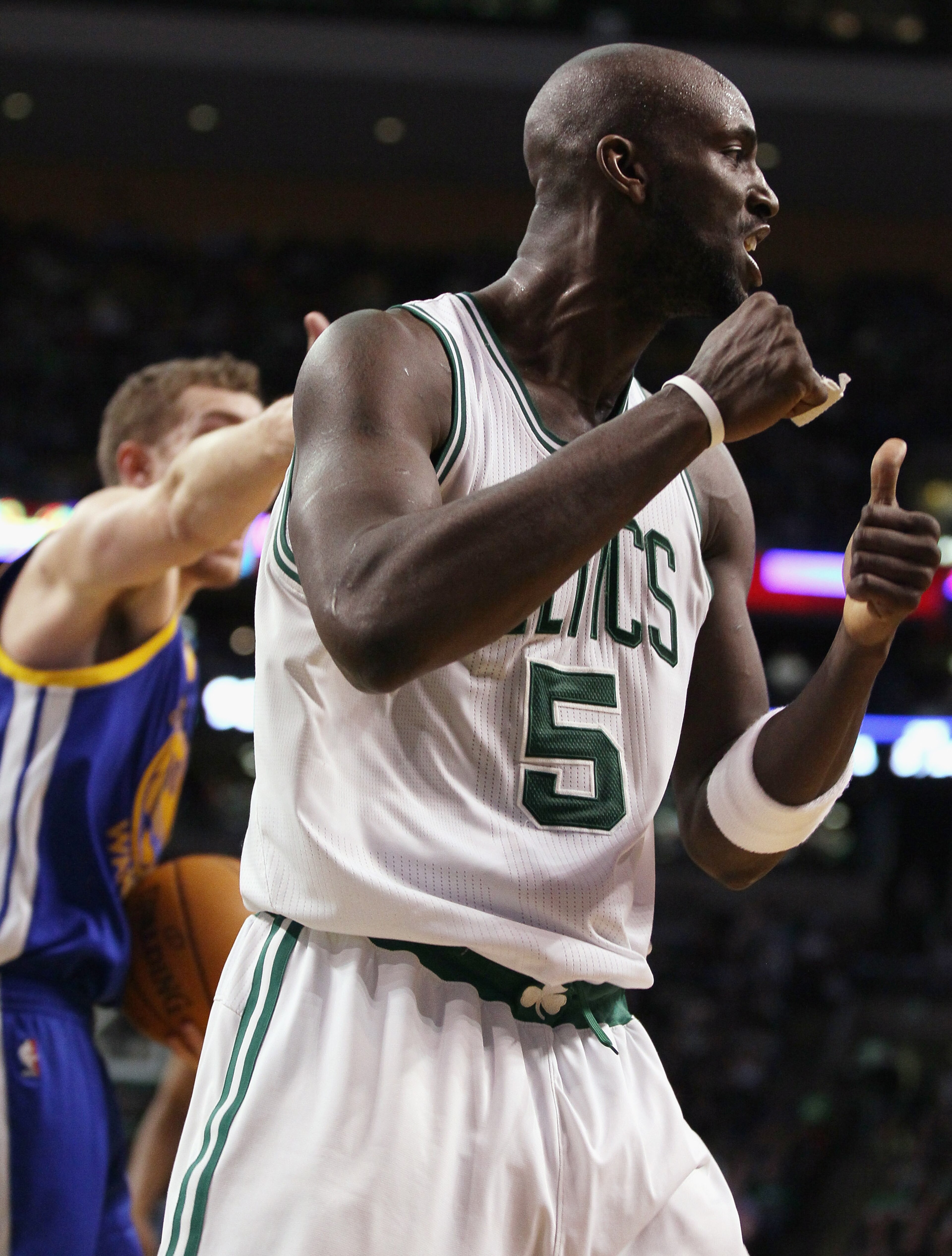 BOSTON, MA - MARCH 04: Kevin Garnett #5 of the Boston Celtics celebrates the jump ball in the fourth quarter against the Golden State Warriors on March 4, 2011 at the TD Garden in Boston, Massachusetts. The Celtics defeated the Warriors 107-103. NOTE TO BOSTON, MA - MARCH 04: Kevin Garnett #5 of the Boston Celtics celebrates the jump ball in the fourth quarter against the Golden State Warriors on March 4, 2011 at the TD Garden in Boston, Massachusetts. The Celtics defeated the Warriors 107-103. NOTE TO