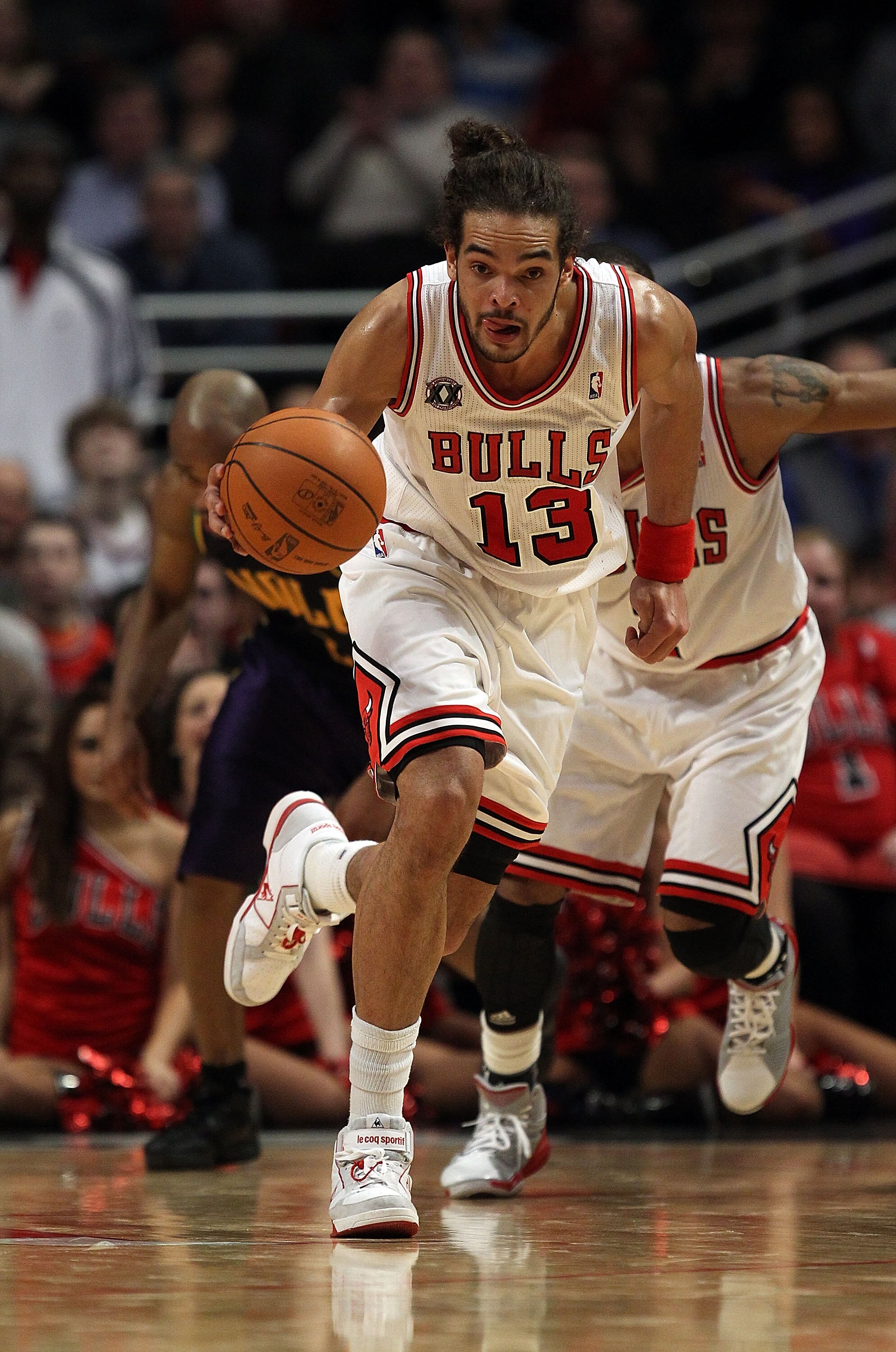 CHICAGO, IL - MARCH 07: Joakim Noah #13 of the Chicago Bulls breaks up the court against the New Orleans Hornets at the United Center on March 7, 2011 in Chicago, Illinois. The Bulls defeated the Hornets 85-77. NOTE TO USER: User expressly acknowledges an