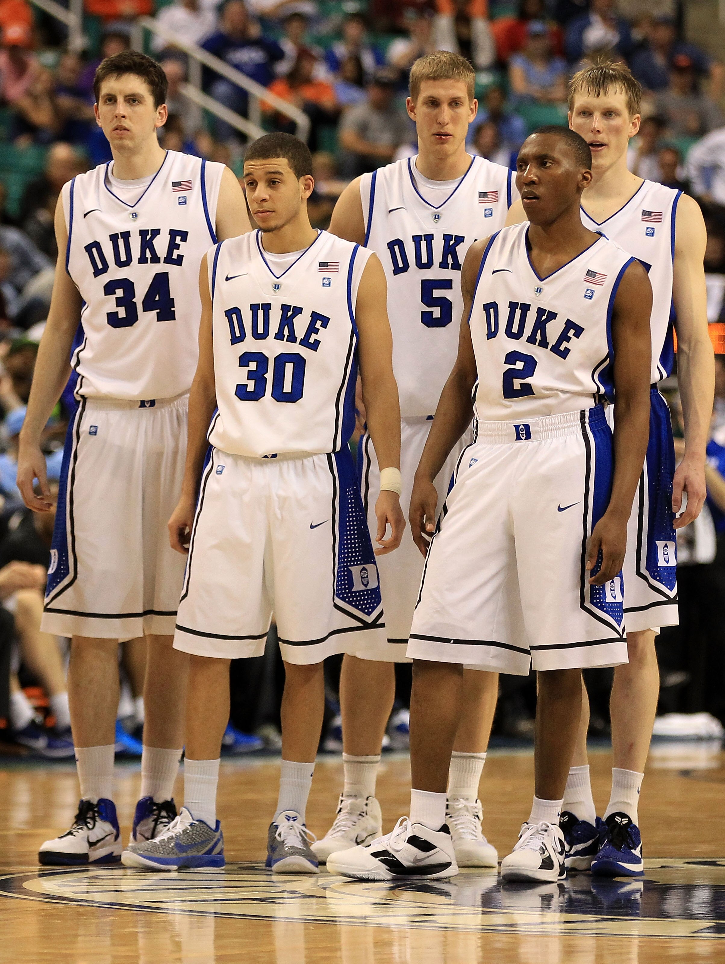GREENSBORO, NC - MARCH 12:  Ryan Kelly #34, Seth Curry #30, Mason Plumlee #5, Nolan Smith #2 and Kyle Singler #12 of the Duke Blue Devils look on during the second half against the Virginia Tech Hokies in the semifinals of the 2011 ACC men's basketball to