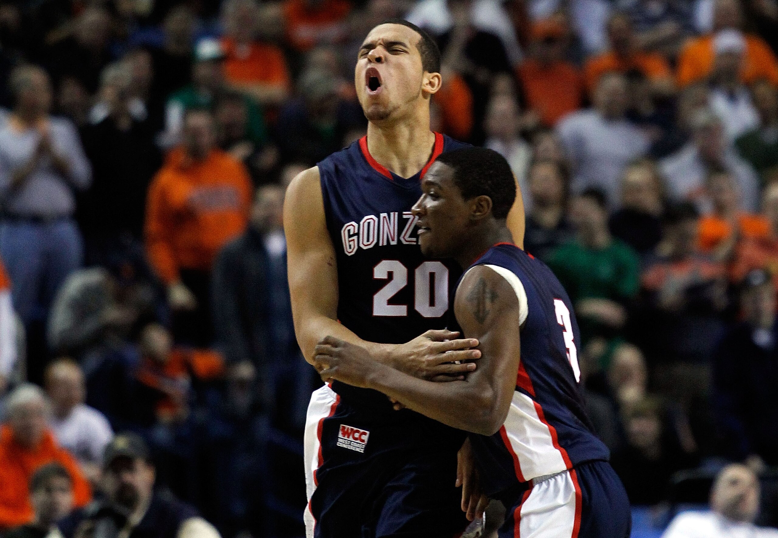 BUFFALO, NY - MARCH 21: Elias Harris #20 of the Gonzaga Bulldogs reacts after a basket with teammate Demetri Goodson #3 of the Syracuse Orange during the second round of the 2010 NCAA men's basketball tournament at HSBC Arena at HSBC Arena on March 21, BUFFALO, NY - MARCH 21: Elias Harris #20 of the Gonzaga Bulldogs reacts after a basket with teammate Demetri Goodson #3 of the Syracuse Orange during the second round of the 2010 NCAA men's basketball tournament at HSBC Arena at HSBC Arena on March 21,