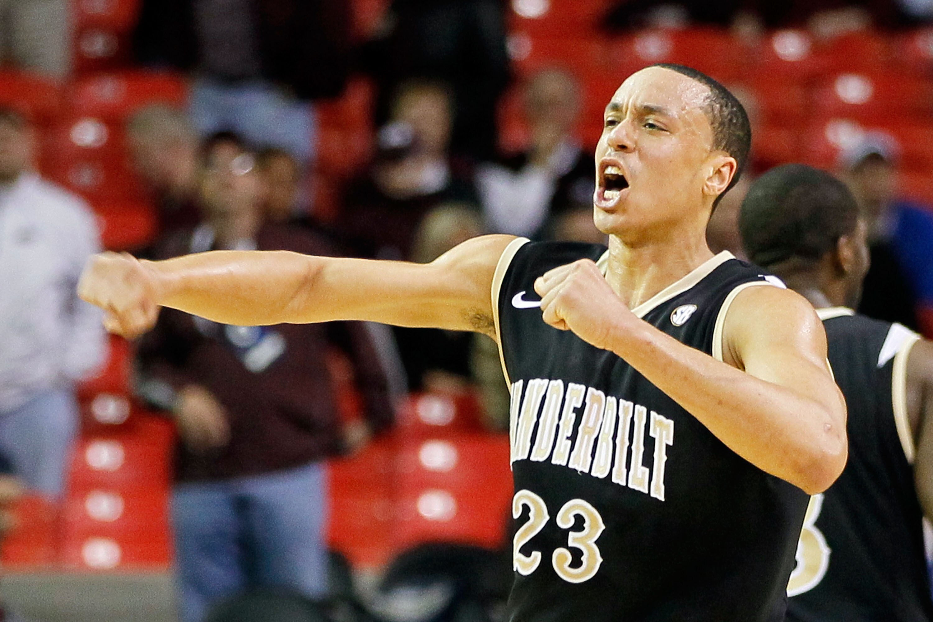 ATLANTA, GA - MARCH 11:  John Jenkins #23 of the Vanderbilt Commodores celebrates their win over the Mississippi State Bulldogs during the quarterfinals of the SEC Men's Basketball Tournament at Georgia Dome on March 11, 2011 in Atlanta, Georgia. The Comm