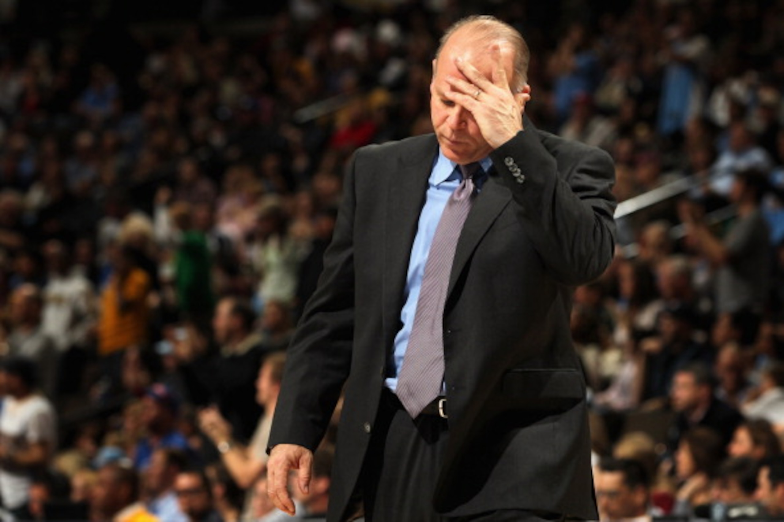 DENVER, CO - MARCH 12: Head coach John Kuester of the Detroit Pistons reacts during a time out against the Denver Nuggets at the Pepsi Center on March 12, 2011 in Denver, Colorado. The Nuggets defeated the Pistons 131-101. NOTE TO USER: User expressly a DENVER, CO - MARCH 12: Head coach John Kuester of the Detroit Pistons reacts during a time out against the Denver Nuggets at the Pepsi Center on March 12, 2011 in Denver, Colorado. The Nuggets defeated the Pistons 131-101. NOTE TO USER: User expressly a