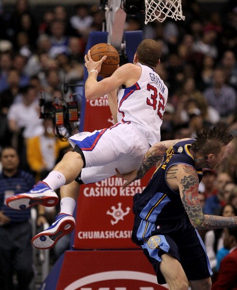 LOS ANGELES, CA - MARCH 05:  Blake Griffin #32 of the Los Angeles Clippers is fouled by Chris Andersen #11 of the Denver Nuggets at Staples Center on March 5, 2011 in Los Angeles, California.  The Clippers won 100-94. NOTE TO USER: User expressly acknowle
