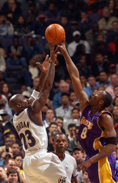 WASHINGTON - NOVEMBER 8:  Michael Jordan #23 of the Washington Wizards attempts to shoot the ball over Kobe Bryant #8 of the Los Angeles Lakers during the game at MCI Center on November 8, 2002 in Washington, D.C.  The Wizards won 100-99.  NOTE TO USER: U