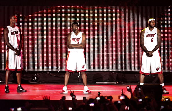 MIAMI - JULY 09:  Fans cheer as (L-R) Chris Bosh #1, Dwyane Wade #3, and LeBron James #6 of the Miami Heat are introduced during a welcome party at American Airlines Arena on July 9, 2010 in Miami, Florida.  (Photo by Marc Serota/Getty Images)