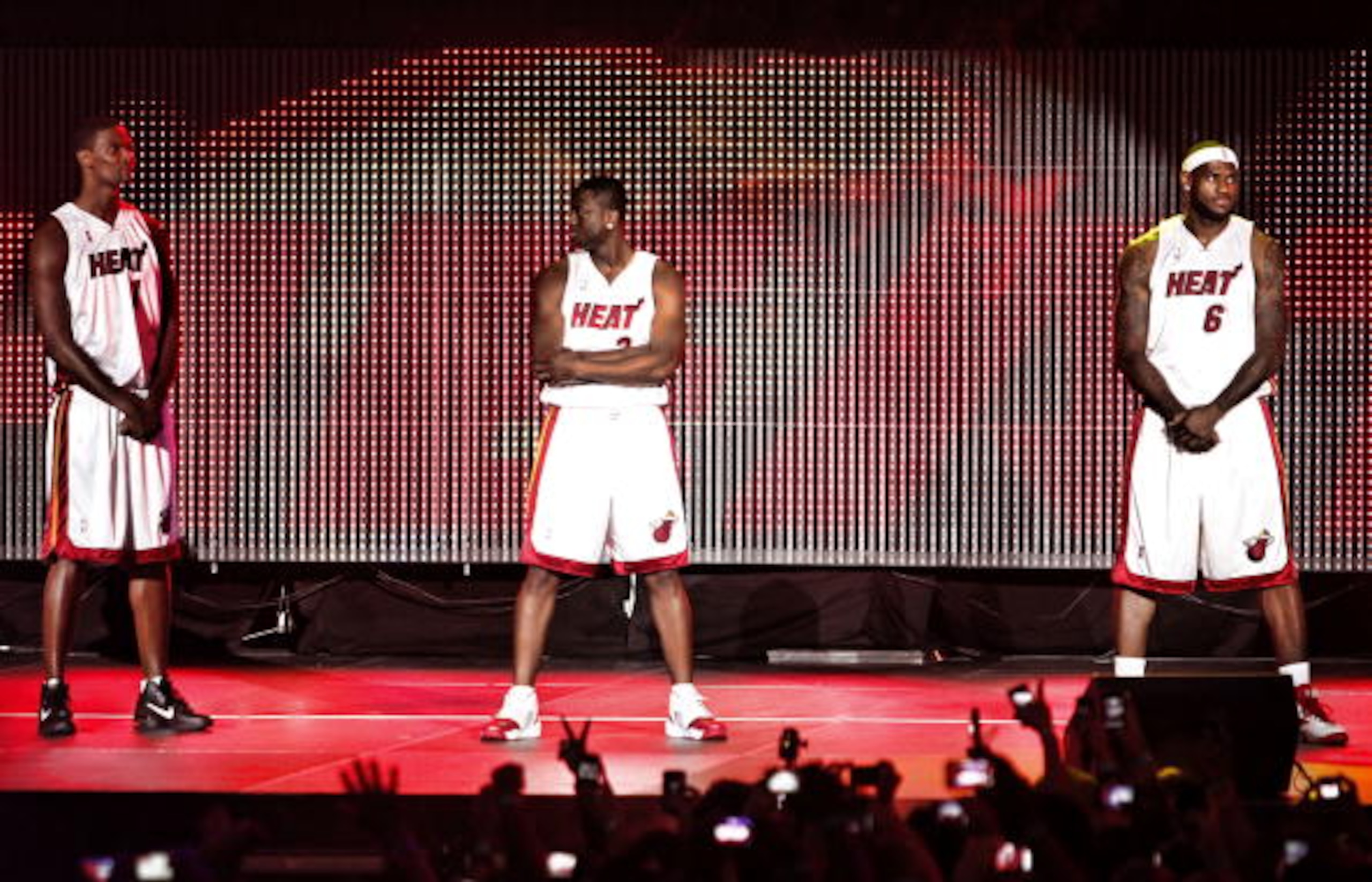 MIAMI - JULY 09: Fans cheer as (L-R) Chris Bosh #1, Dwyane Wade #3, and LeBron James #6 of the Miami Heat are introduced during a welcome party at American Airlines Arena on July 9, 2010 in Miami, Florida. (Photo by Marc Serota/Getty Images) MIAMI - JULY 09: Fans cheer as (L-R) Chris Bosh #1, Dwyane Wade #3, and LeBron James #6 of the Miami Heat are introduced during a welcome party at American Airlines Arena on July 9, 2010 in Miami, Florida. (Photo by Marc Serota/Getty Images)