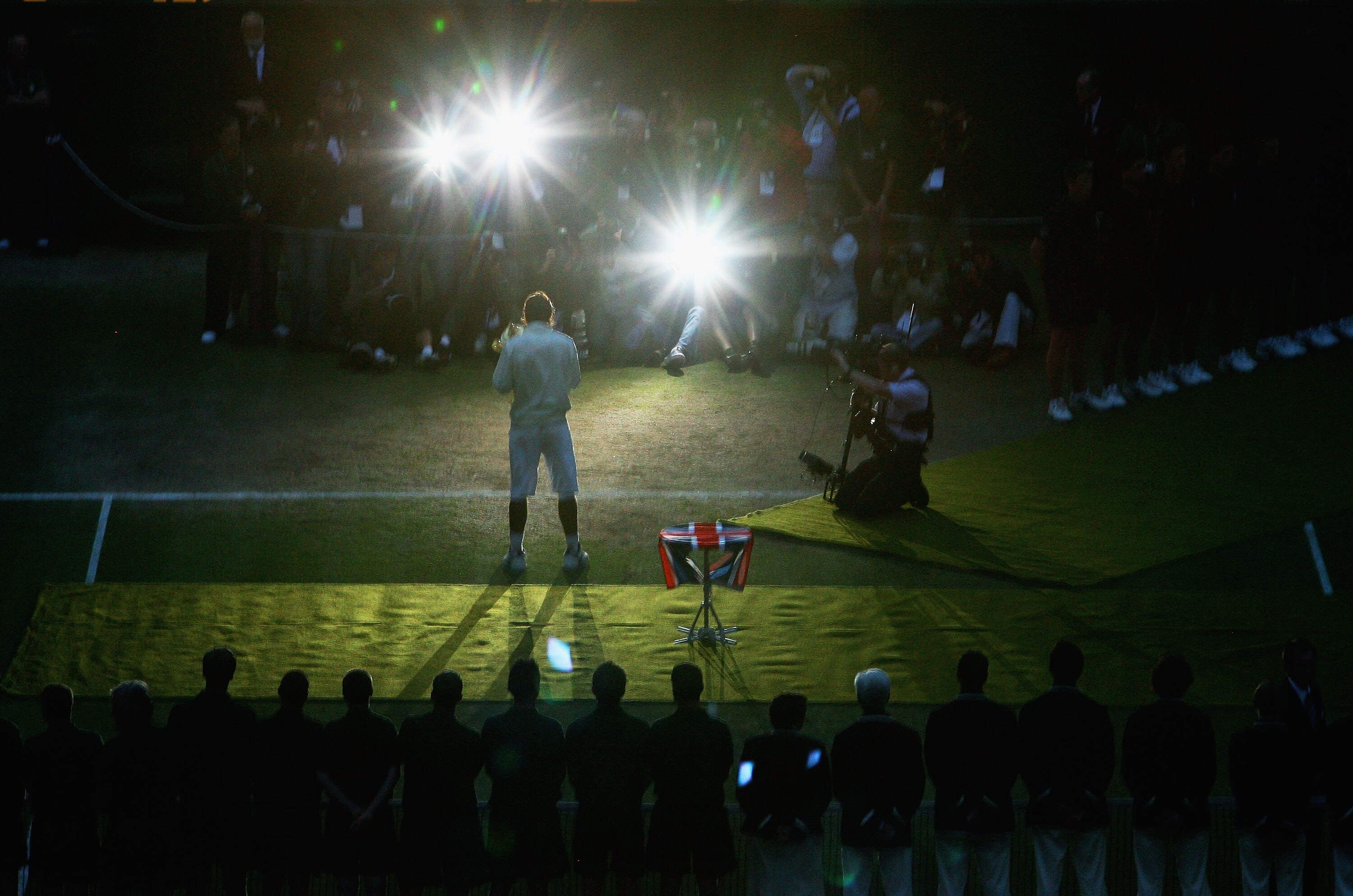 LONDON - JULY 06:  Rafael Nadal of Spain poses for photographers with the Championship trophy after winning the men's singles Final match against Roger Federer of Switzerland on day thirteen of the Wimbledon Lawn Tennis Championships at the All England La