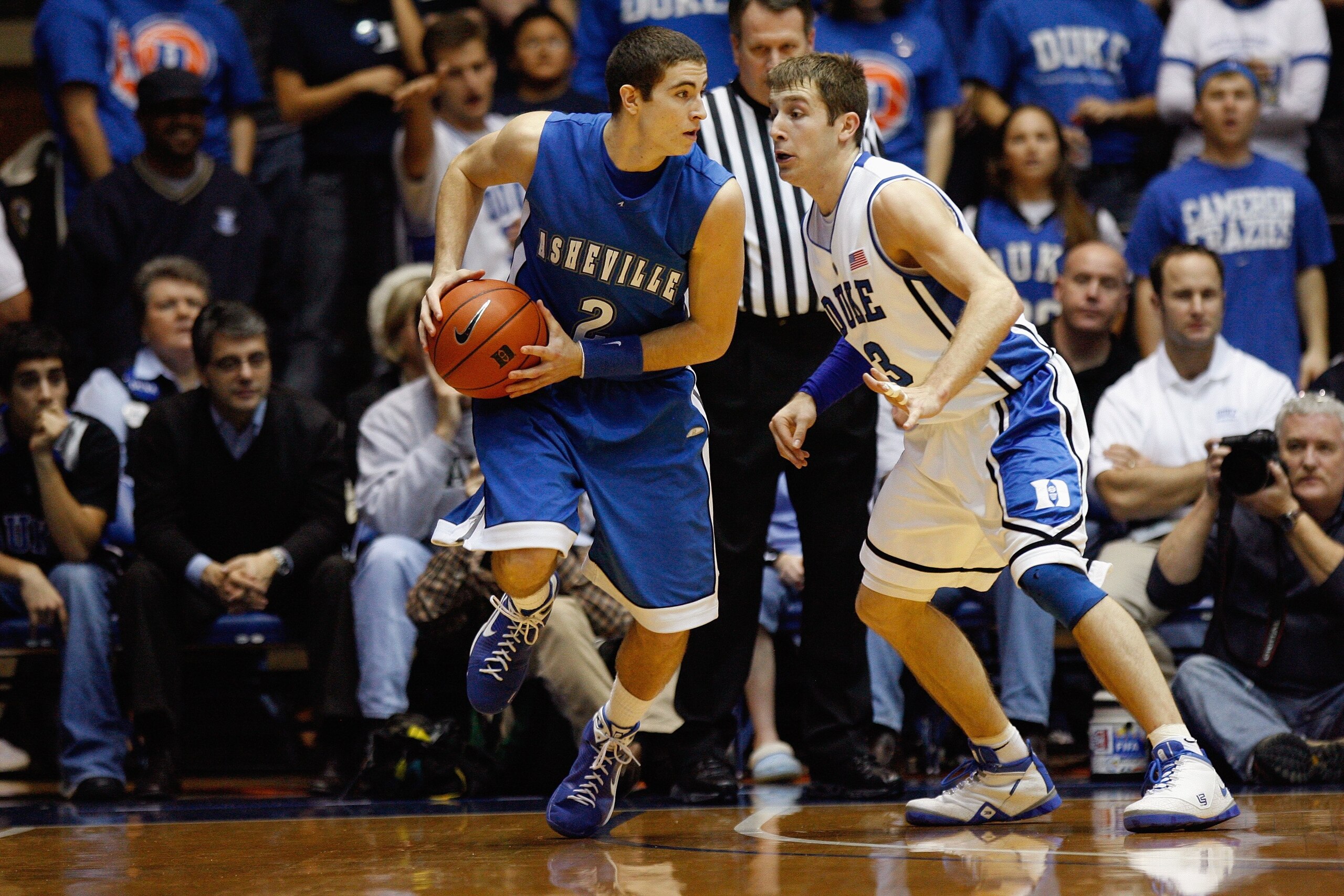 DURHAM, NC - DECEMBER 17:  Greg Paulus #3 of the Duke Blue Devils defends against Matt Dickey #2 of the North Carolina Asheville Bulldogs on December 17, 2008 at Cameron Indoor Stadium in Durham, North Carolina. (Photo by Kevin C. Cox/Getty Images)