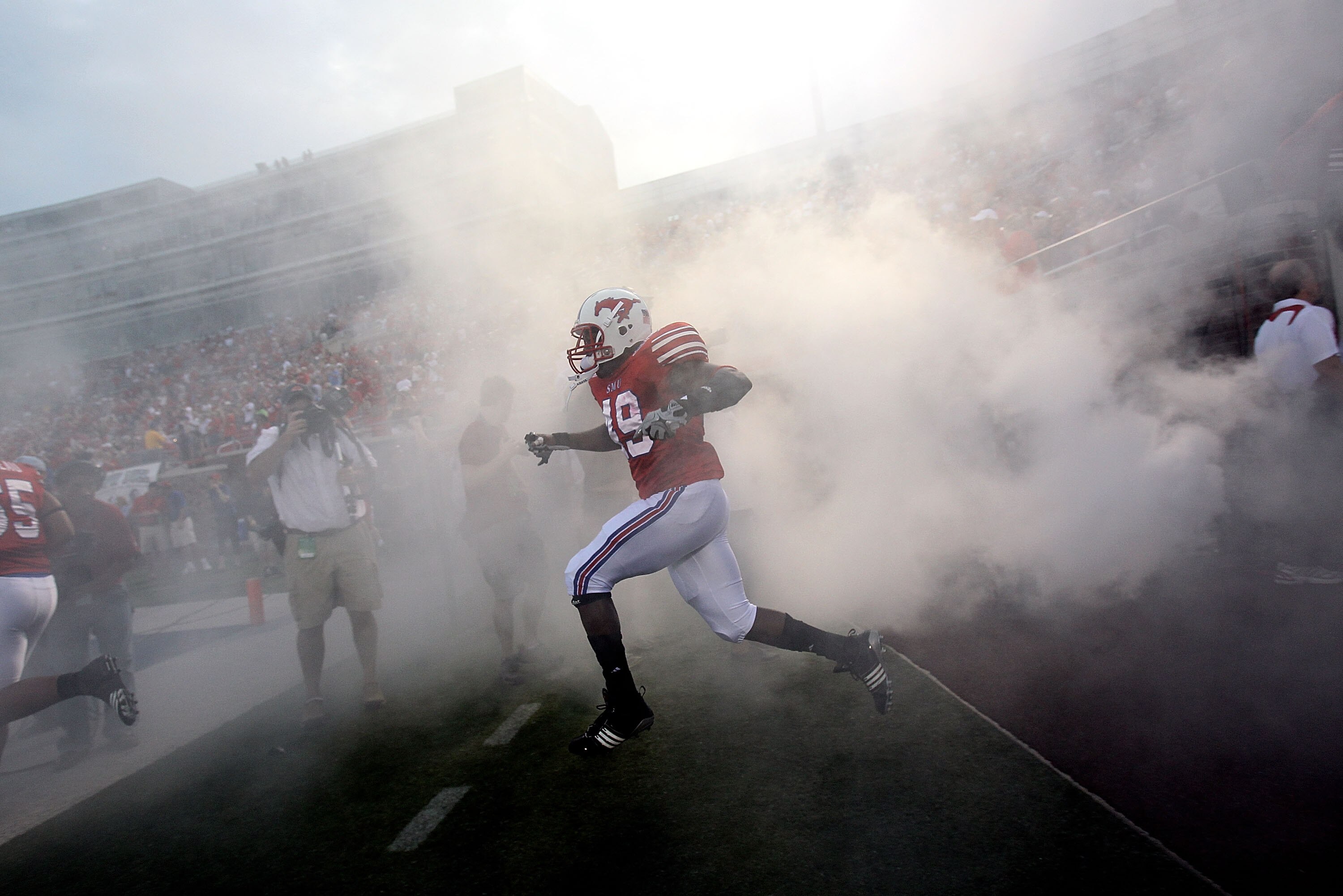 DALLAS - SEPTEMBER 24:  Linebacker Byron Brown #49 of the SMU Mustangs enters the field before a game against the TCU Horned Frogs at Gerald J. Ford Stadium on September 24, 2010 in Dallas, Texas.  (Photo by Ronald Martinez/Getty Images)