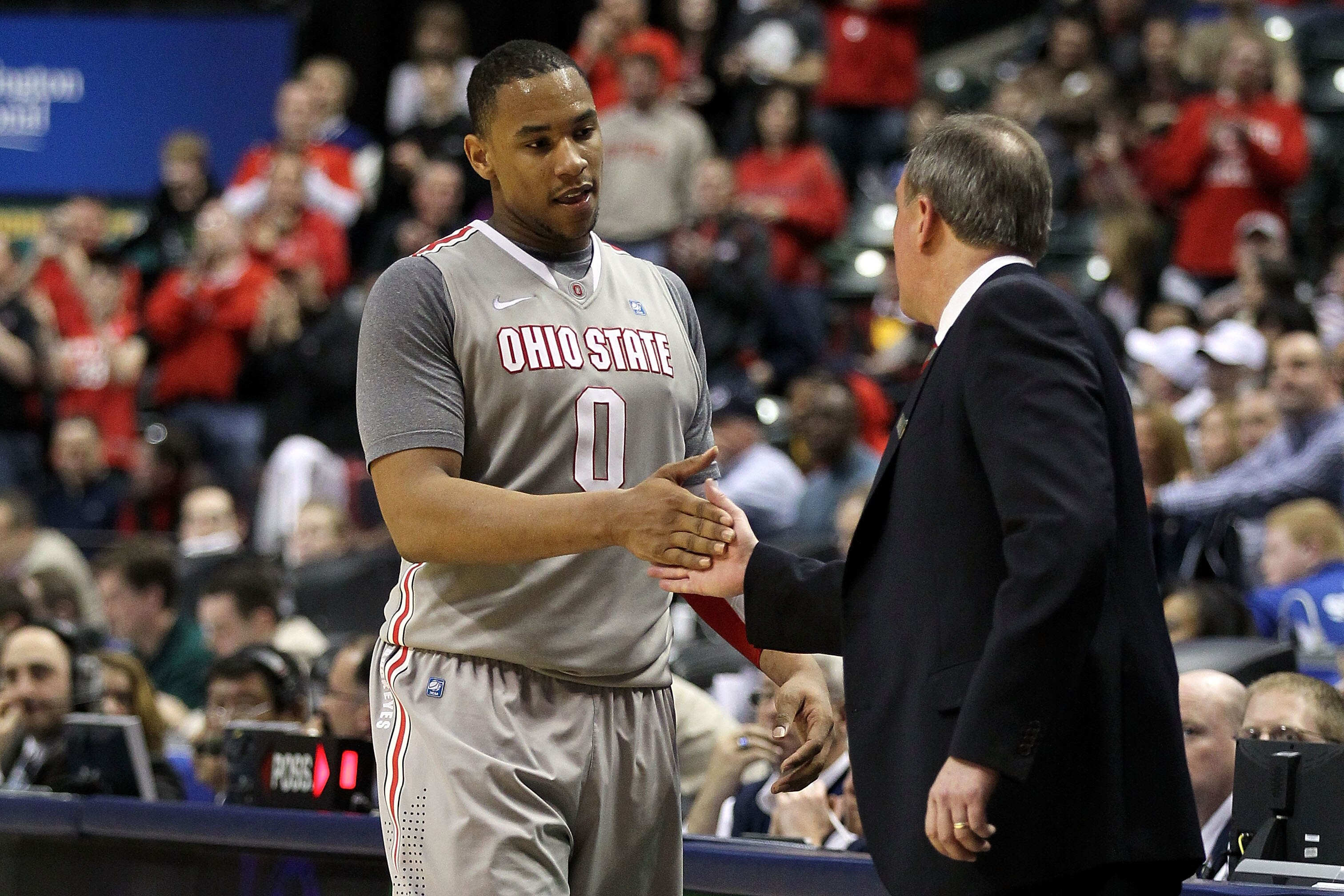 INDIANAPOLIS, IN - MARCH 13:  Jared Sullinger #0 of the Ohio State Buckeyes celebrates with head coach Thad Matta after he was taken out of the game late in the second half against the Penn State Nittany Lions during the championship game of the 2011 Big